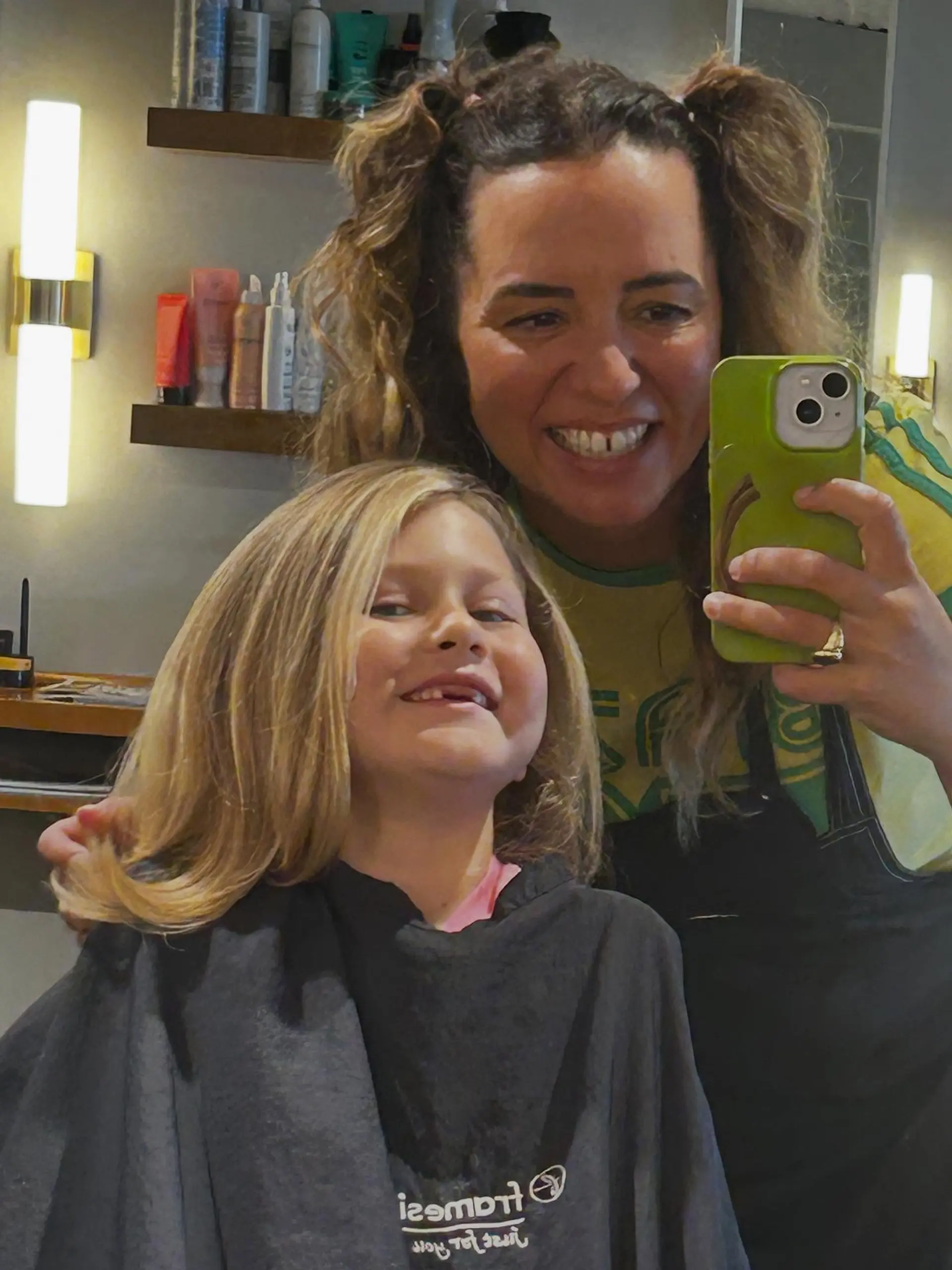 A sleek and voluminous blowout with soft curved ends on medium blonde hair. 1
