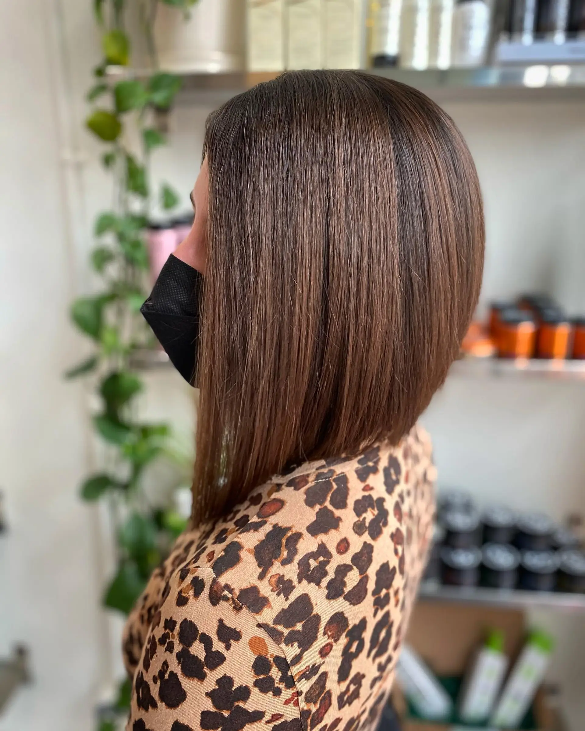 A sleek, precision-cut angled bob styled straight with smooth volume. 1