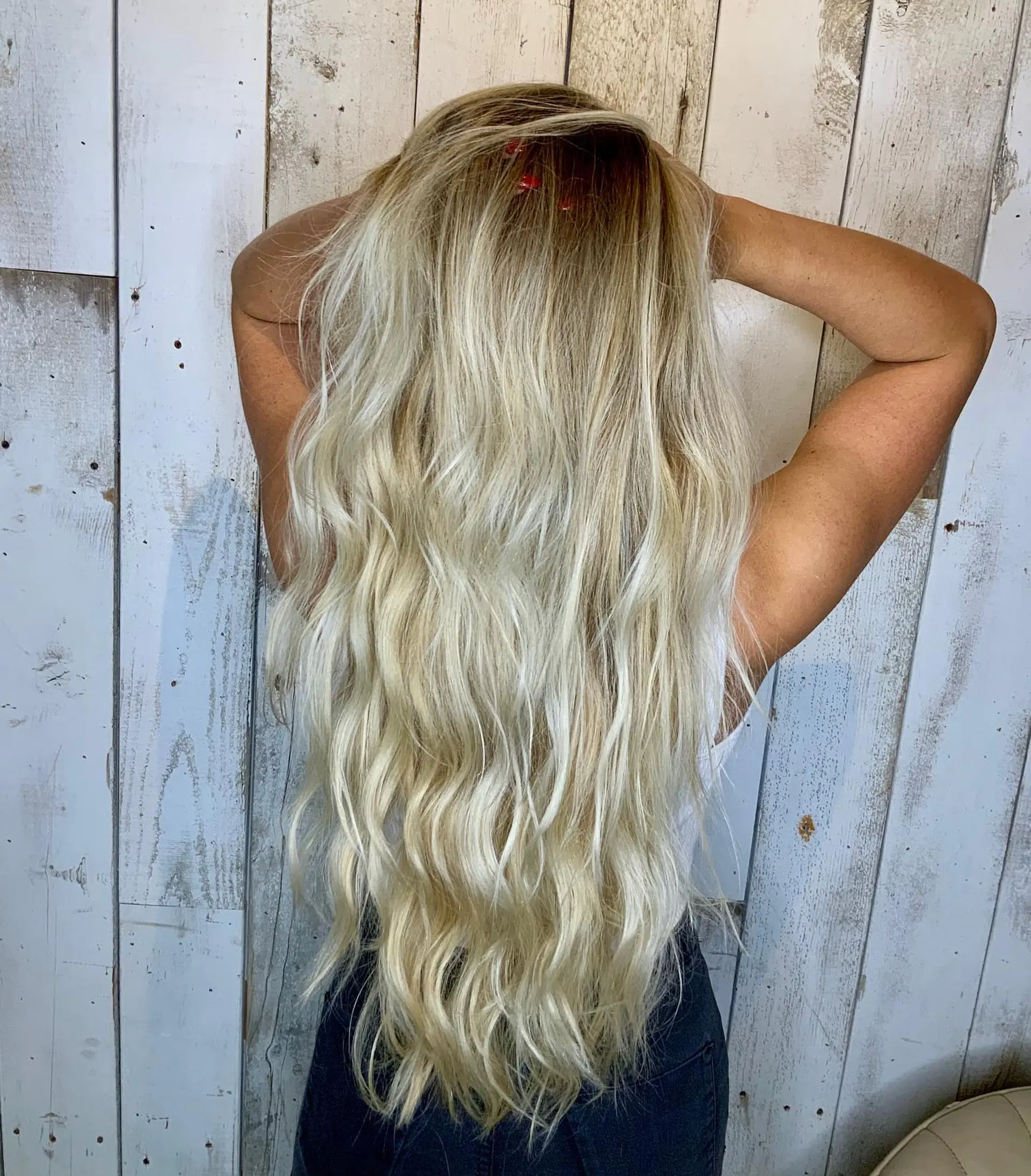 Extra-long pale blonde hair styled in effortless, dimensional mermaid waves. 1