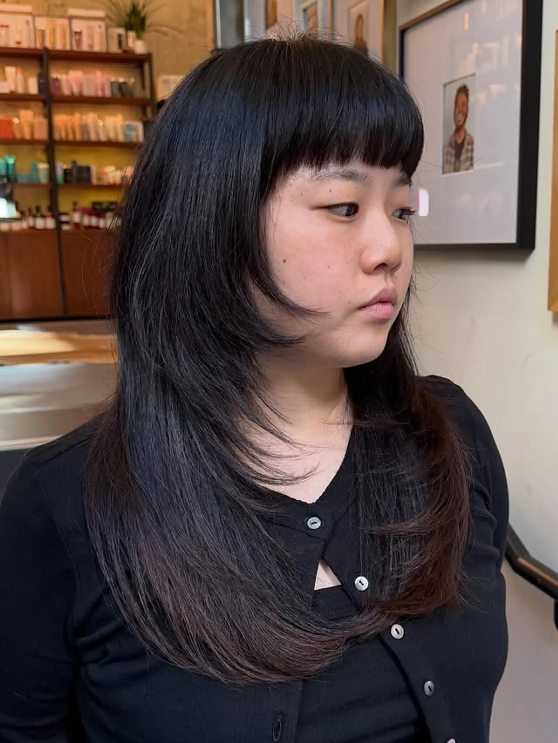 A trendy shag haircut with blunt bangs and layered texture. 1