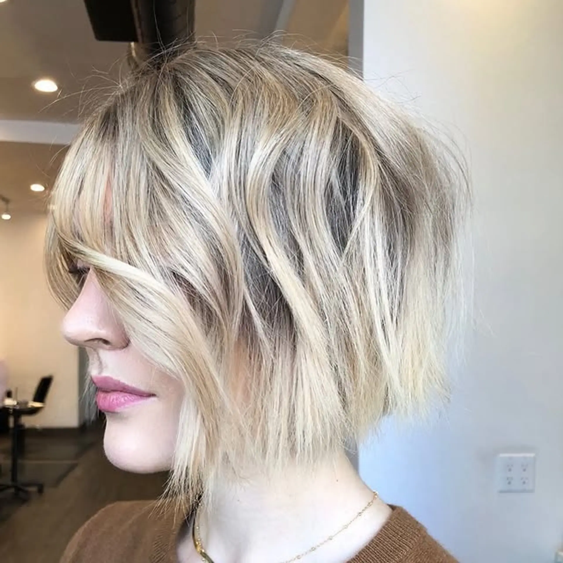 A textured, choppy bob with fringe bangs. 1
