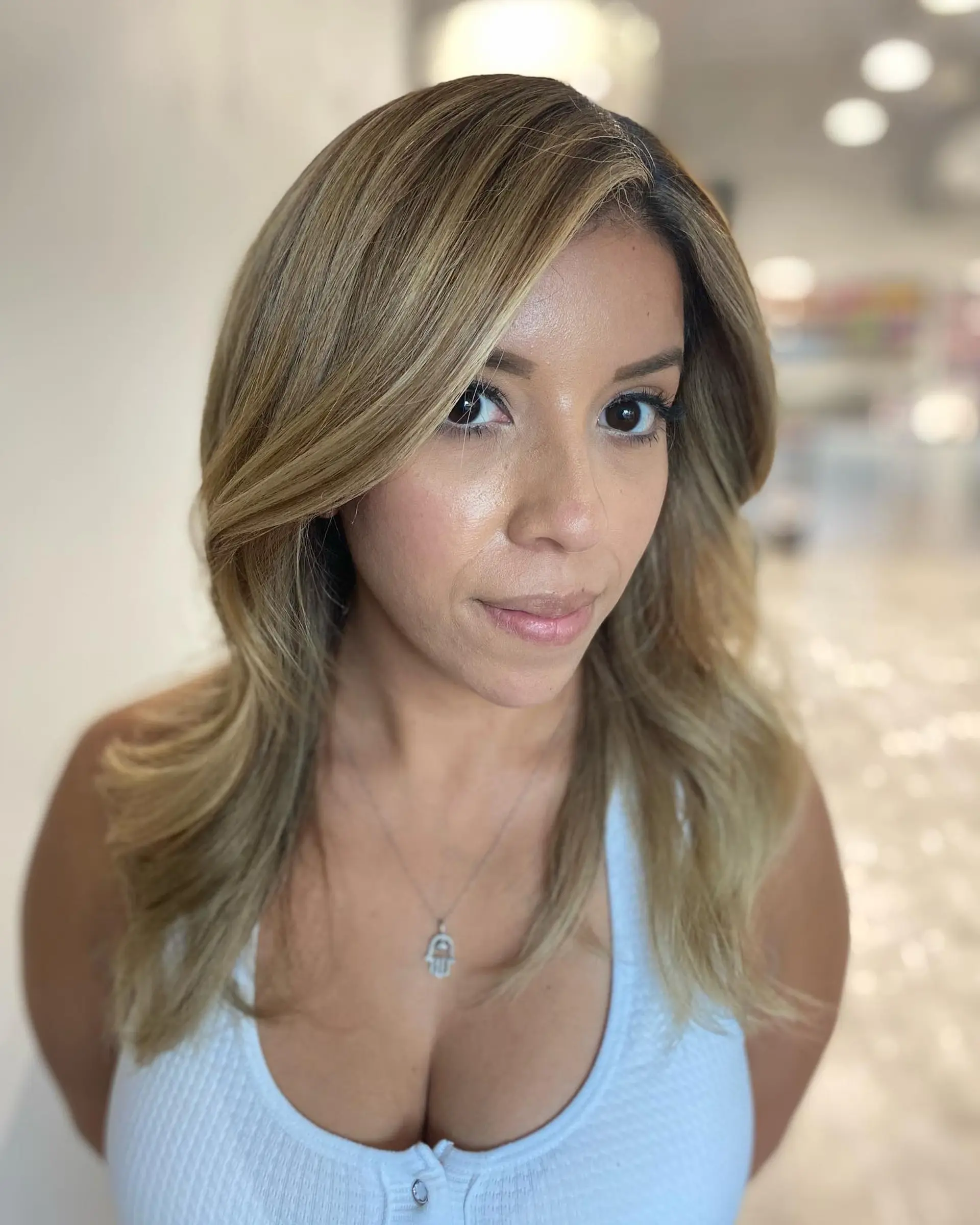 A dimensional bronde balayage with soft, flowing waves. 2