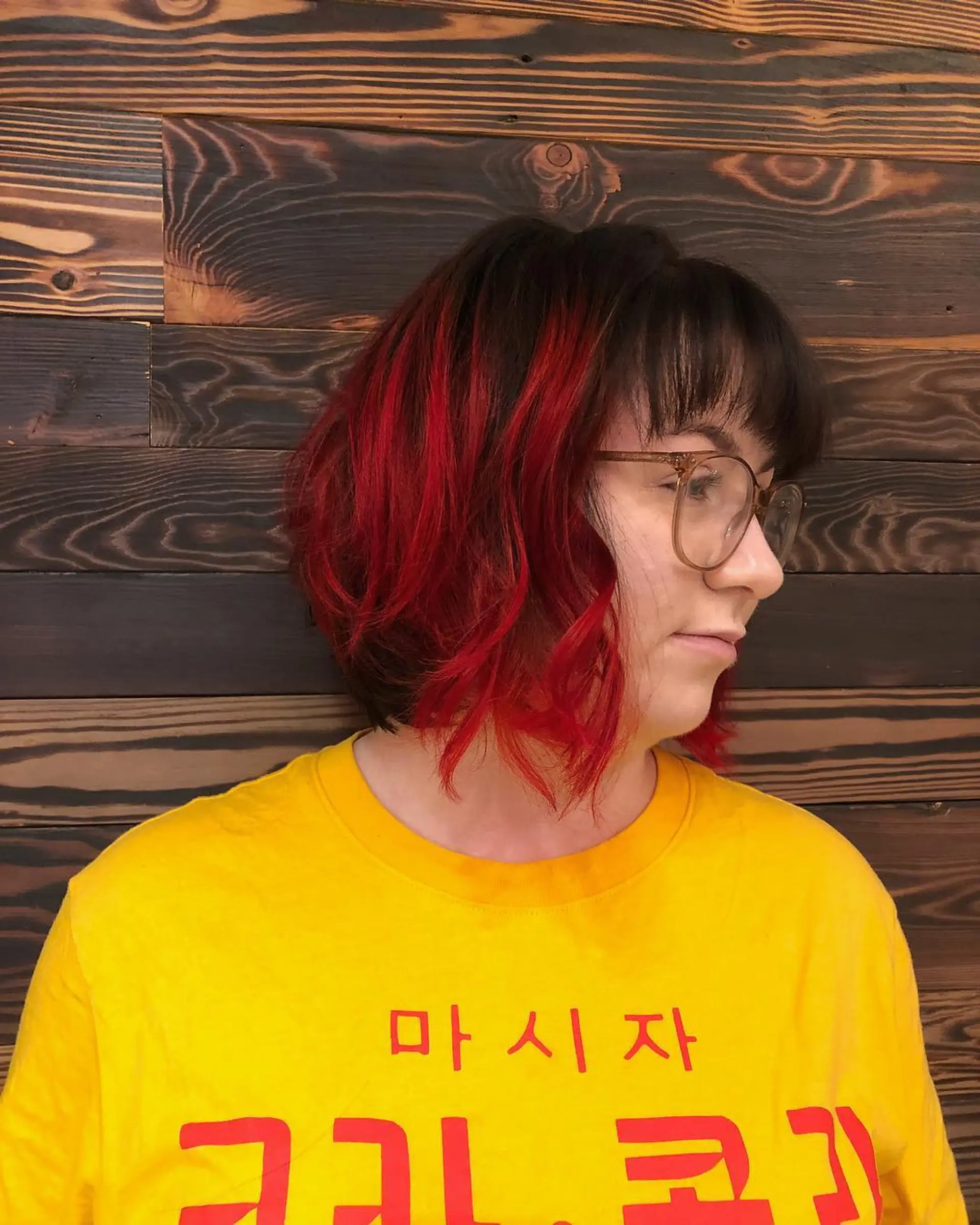 A medium-length wavy bob with blunt bangs and a striking dip dye effect. 1