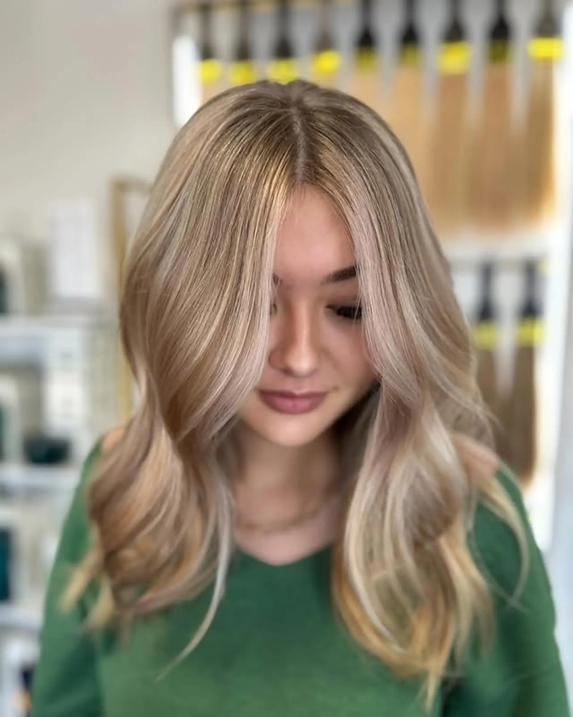 A medium length wavy style with face-framing layers and a beautiful balayage. 1