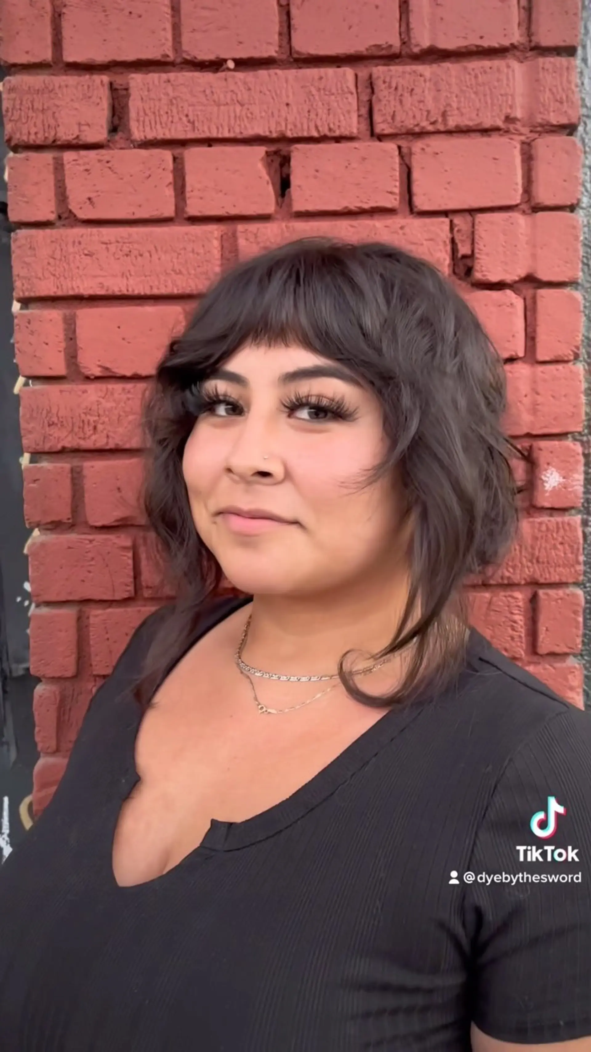 A textured shaggy bob featuring choppy fringe bangs and piecey, face-framing layers. 1