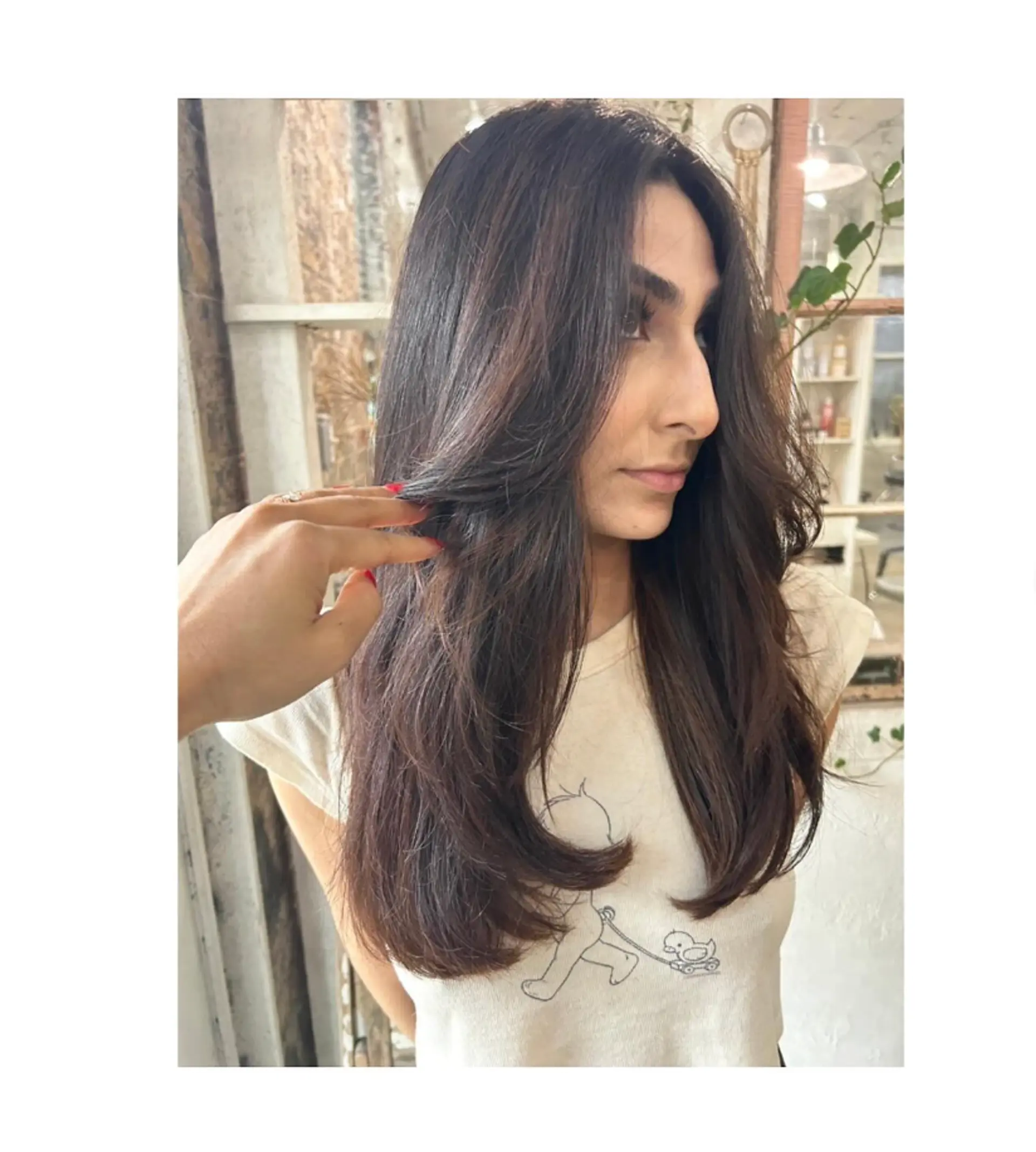 Long, straight brunette hair with face-framing layers and a smooth blowout. 1