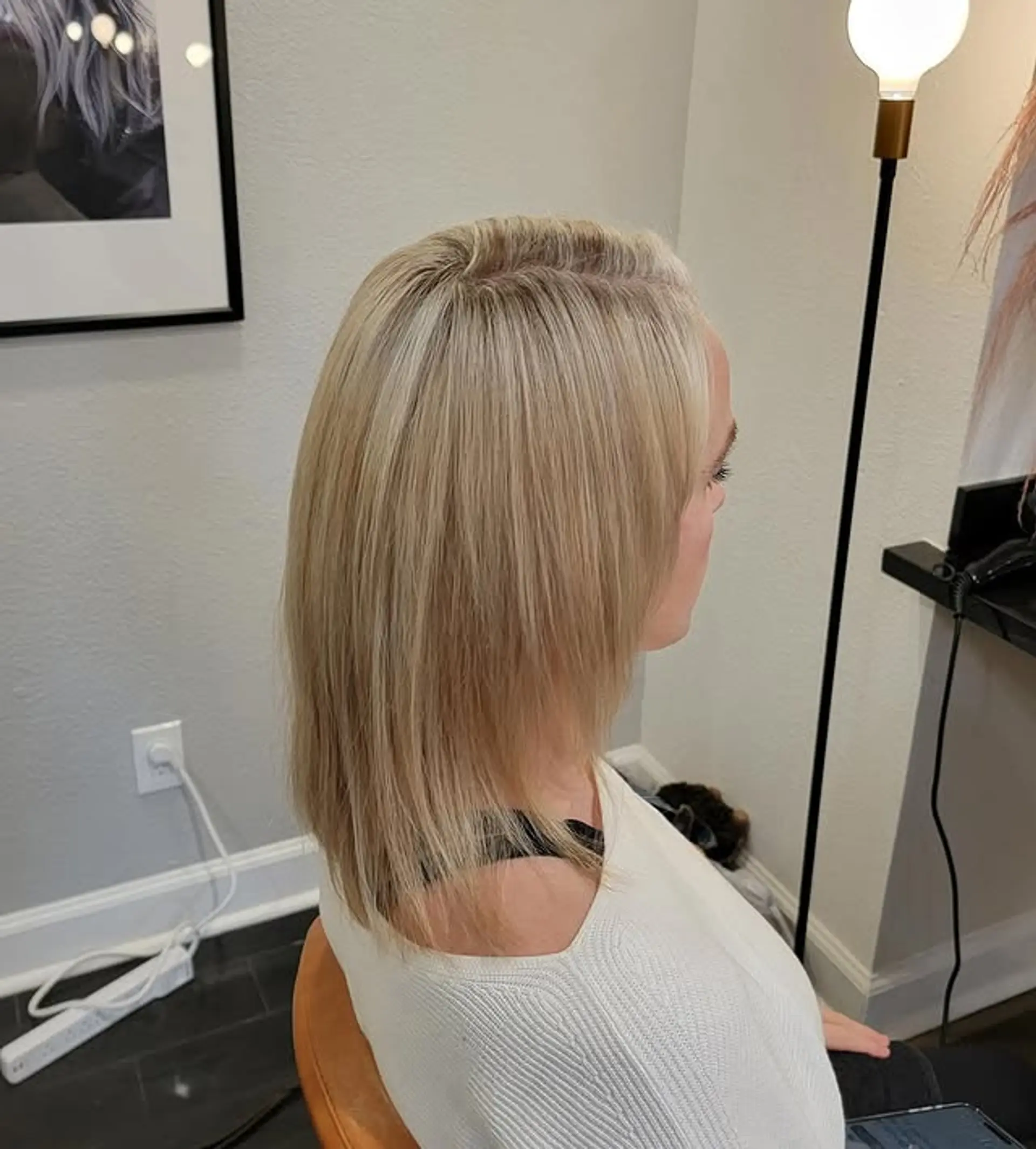 A sleek, straight lob cut that falls to the shoulders, featuring subtle layers for movement and a soft, modern finish. 1