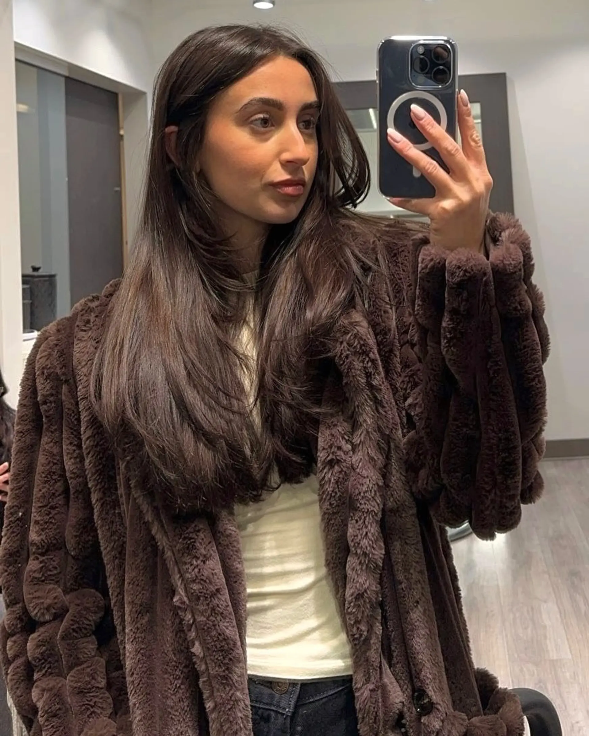 Long layered brunette hair with a smooth, voluminous blowout. 1