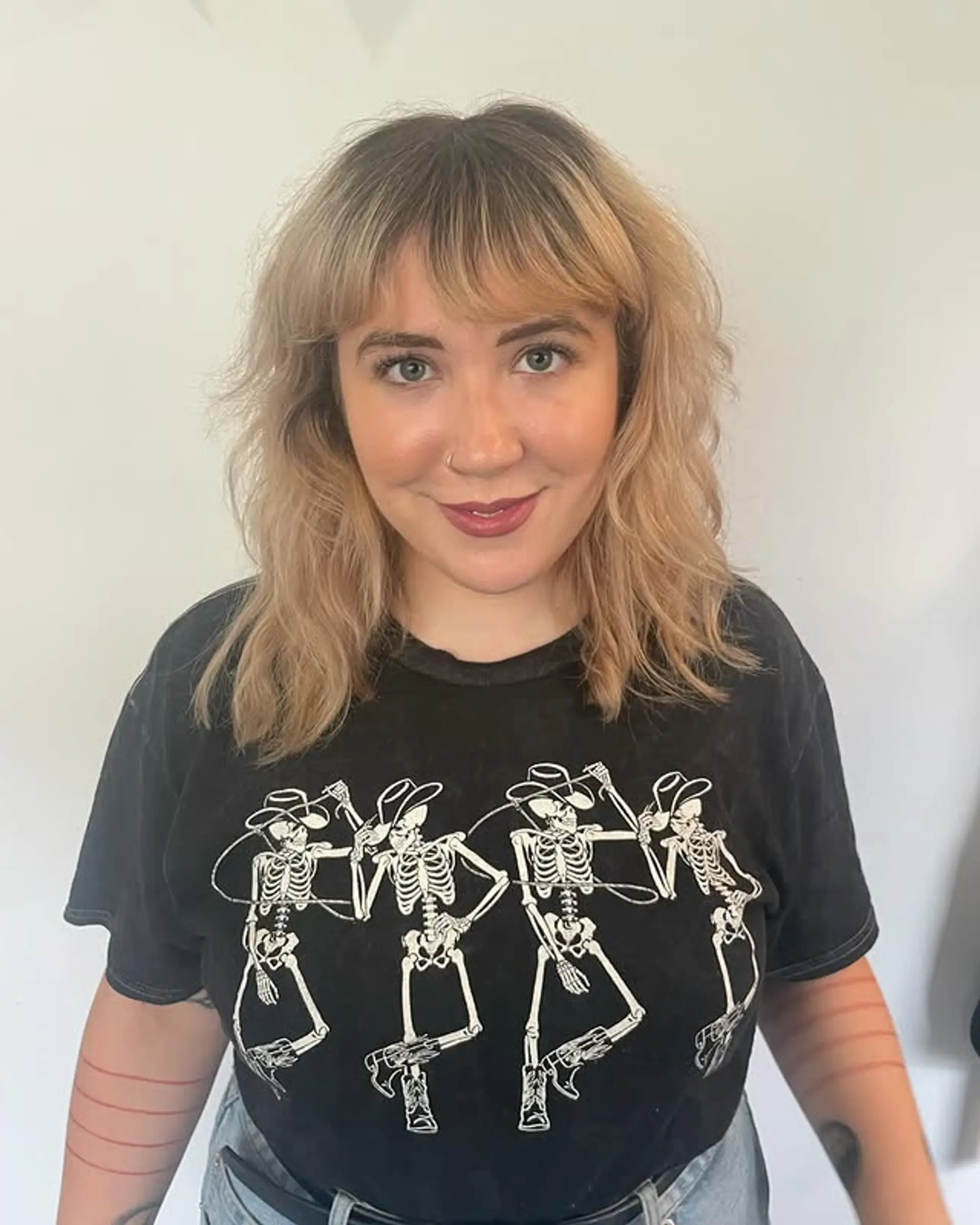 A layered shag with face-framing curtain bangs. 1