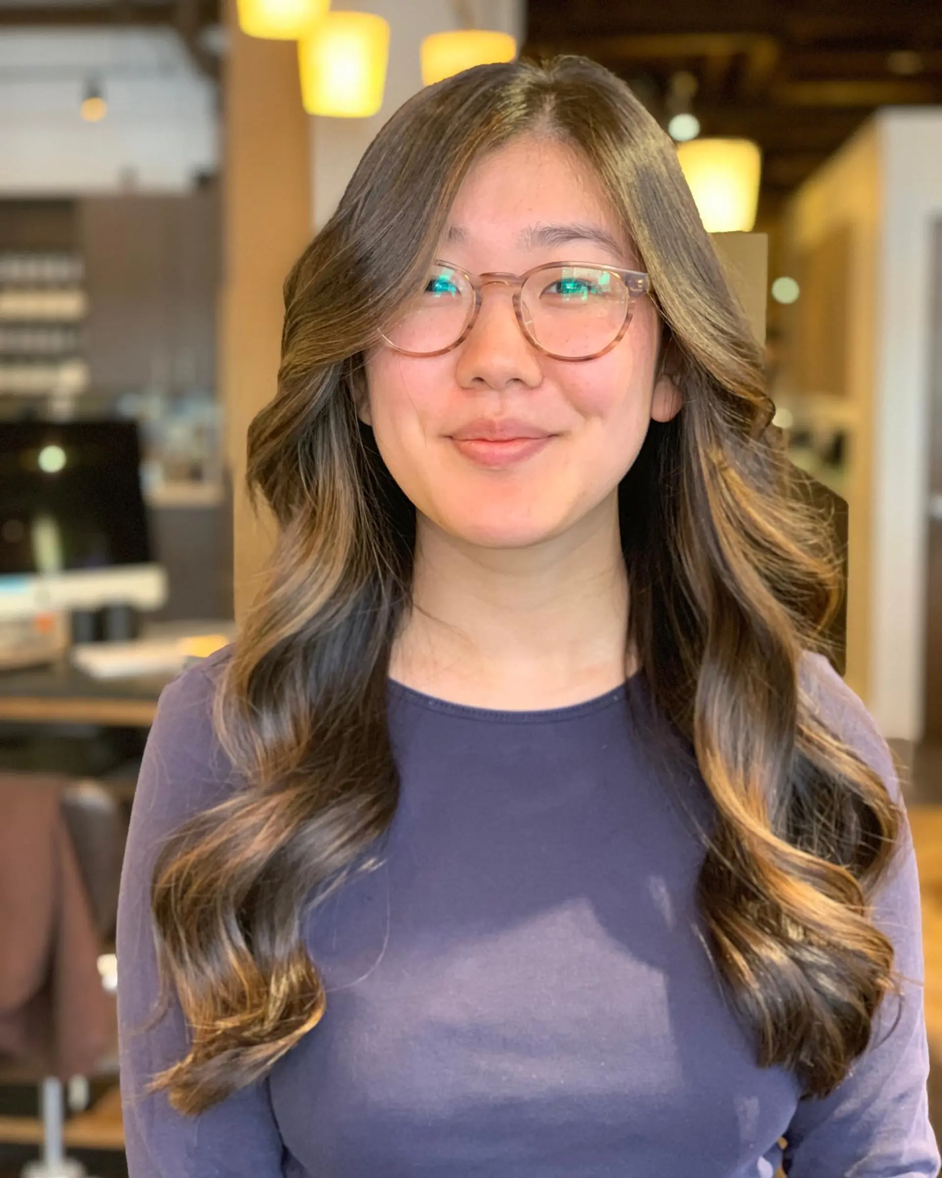 Long, layered waves with a soft, face-framing balayage. 1