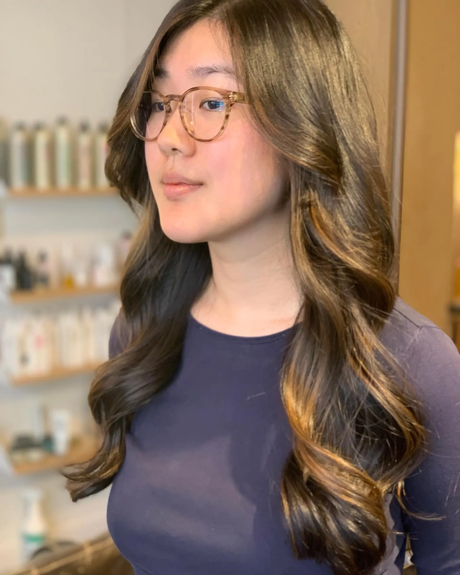 Long, layered waves with a soft, face-framing balayage. 2