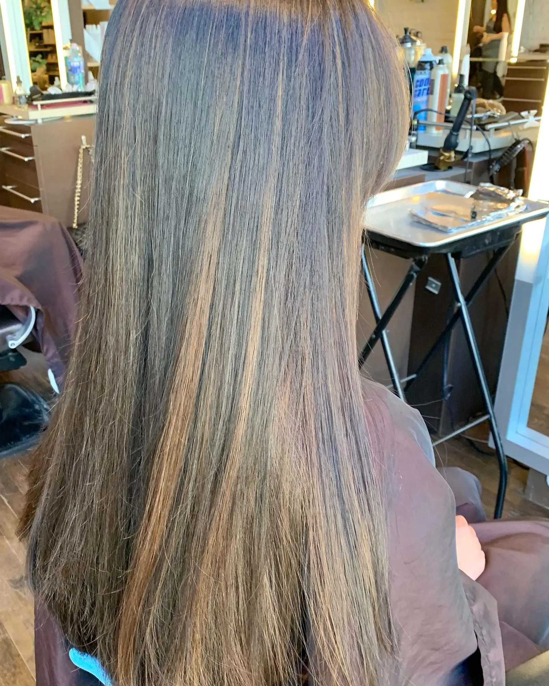 Long, layered waves with a soft, face-framing balayage. 4