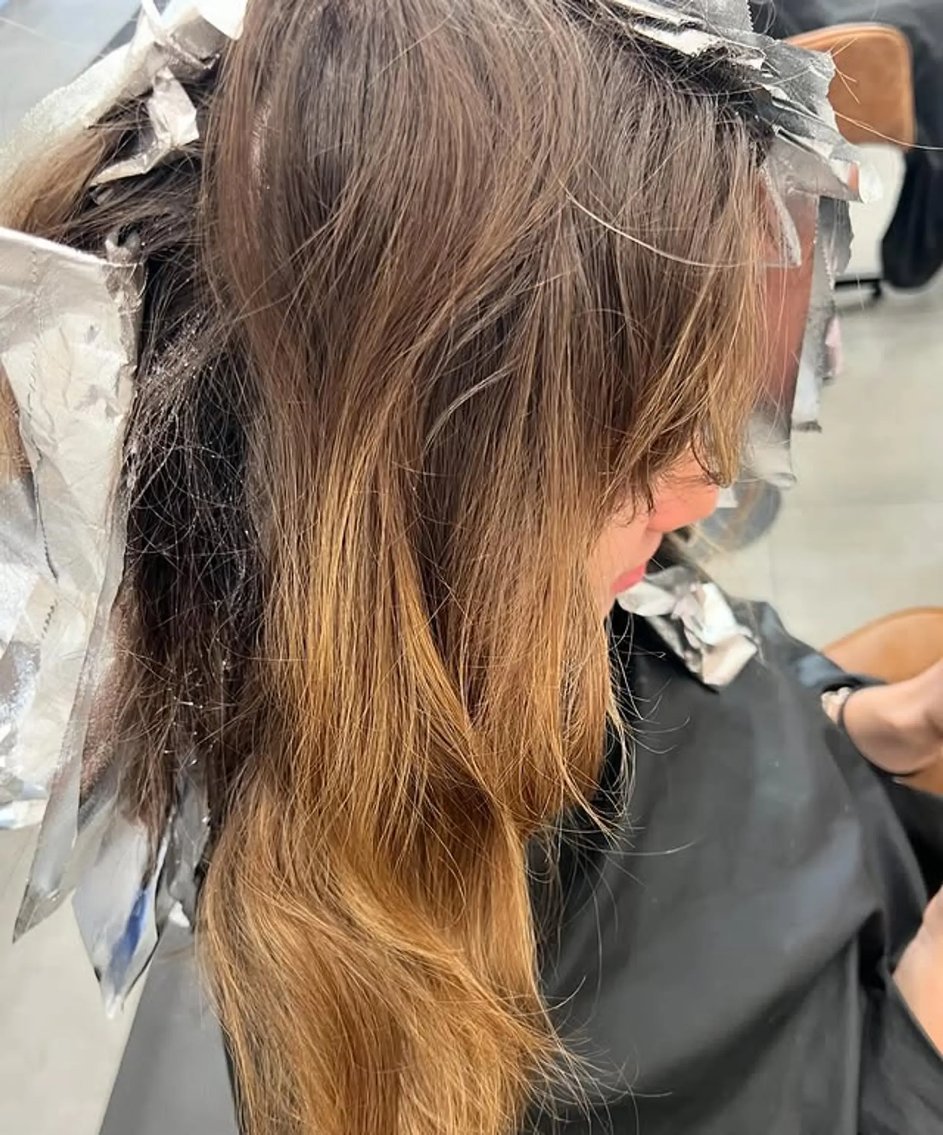 Bronde balayage with subtle highlights creating a sun-kissed effect. 1