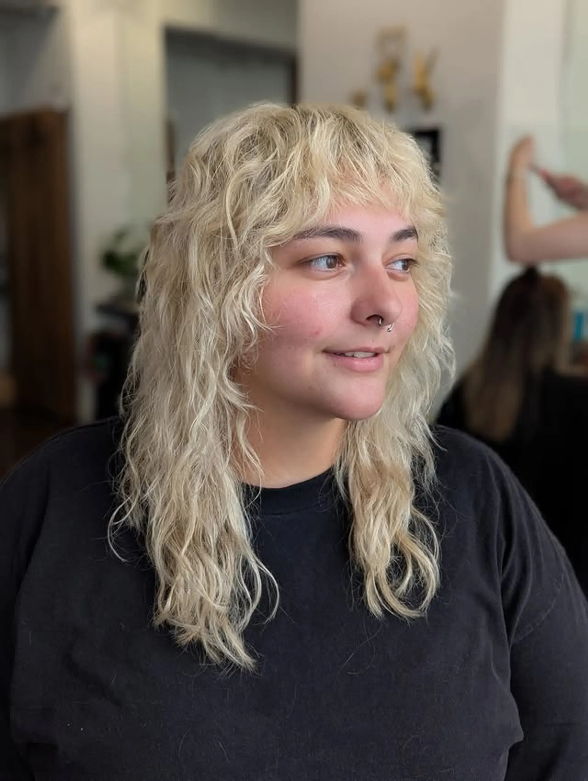 A modern take on the classic mullet with shaggy layers and choppy bangs. 1