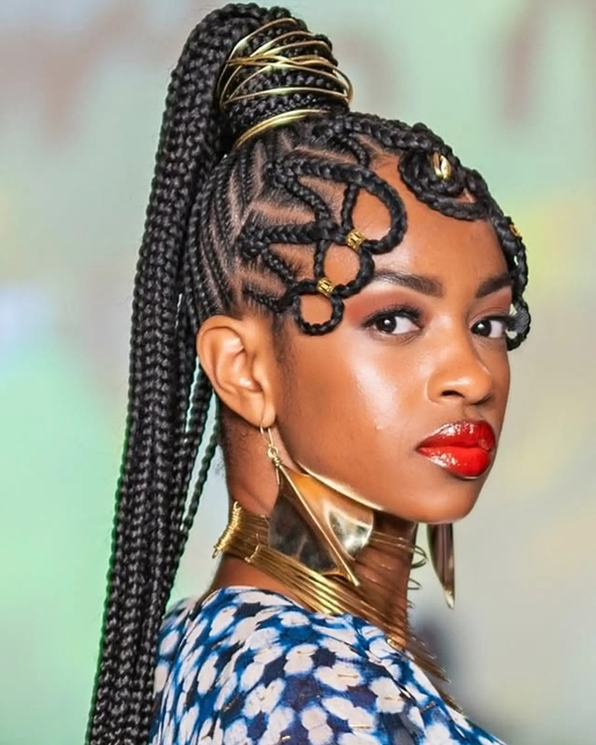 A long, braided ponytail with decorative braid detailing at the front. 1