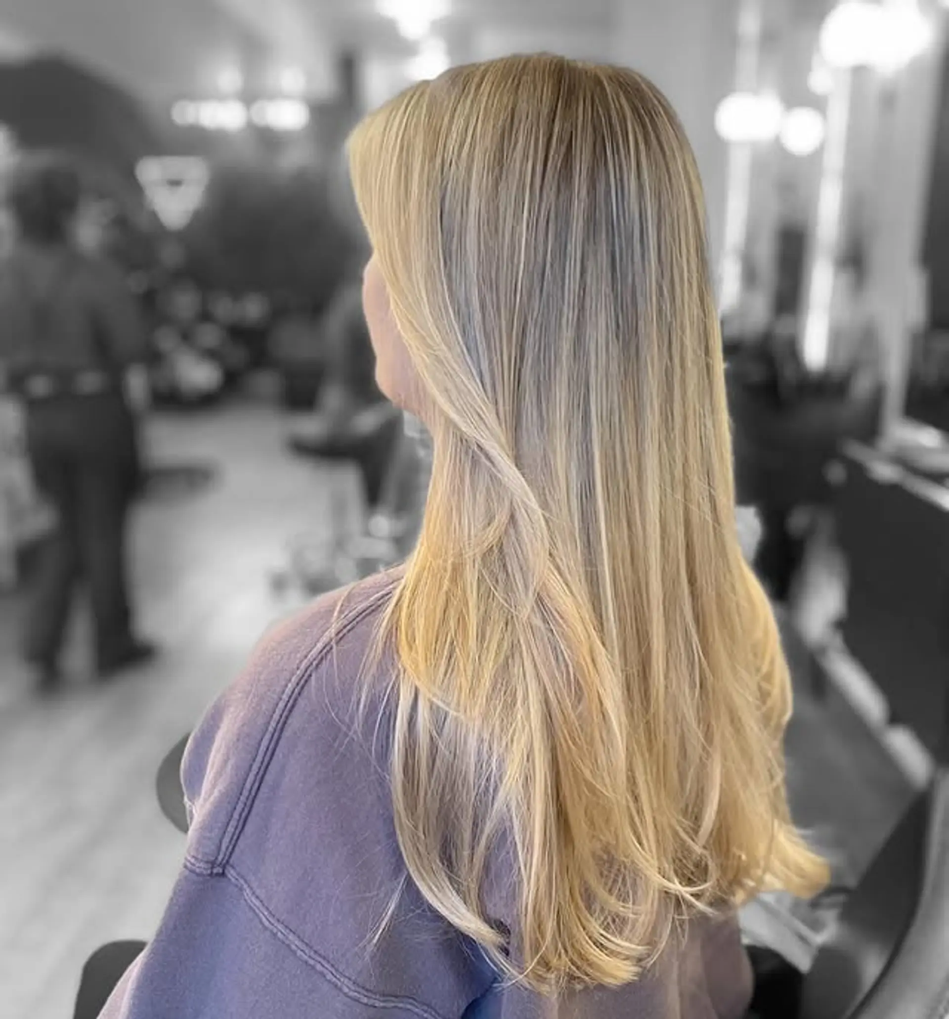 Long, straight, layered hairstyle with face framing layers and full bangs. 1