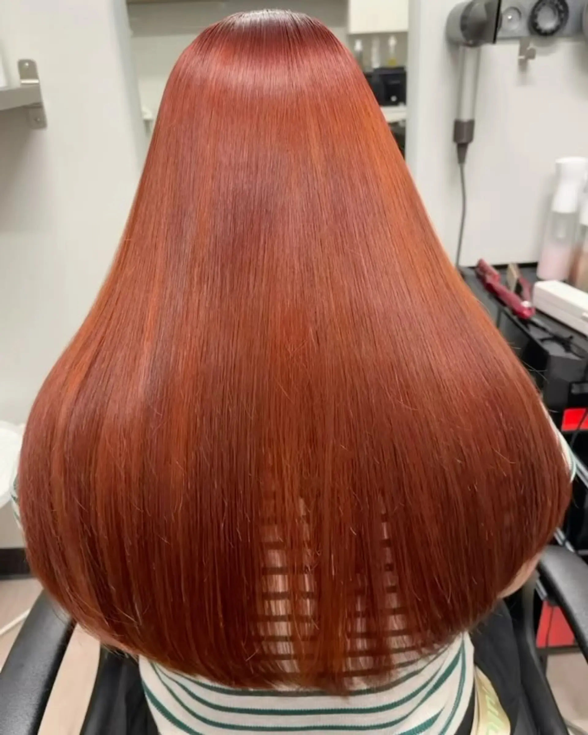 Ultra-sleek, glossy straight long hair in a vibrant copper-red tone, showcasing a smooth, glass-like finish. 1