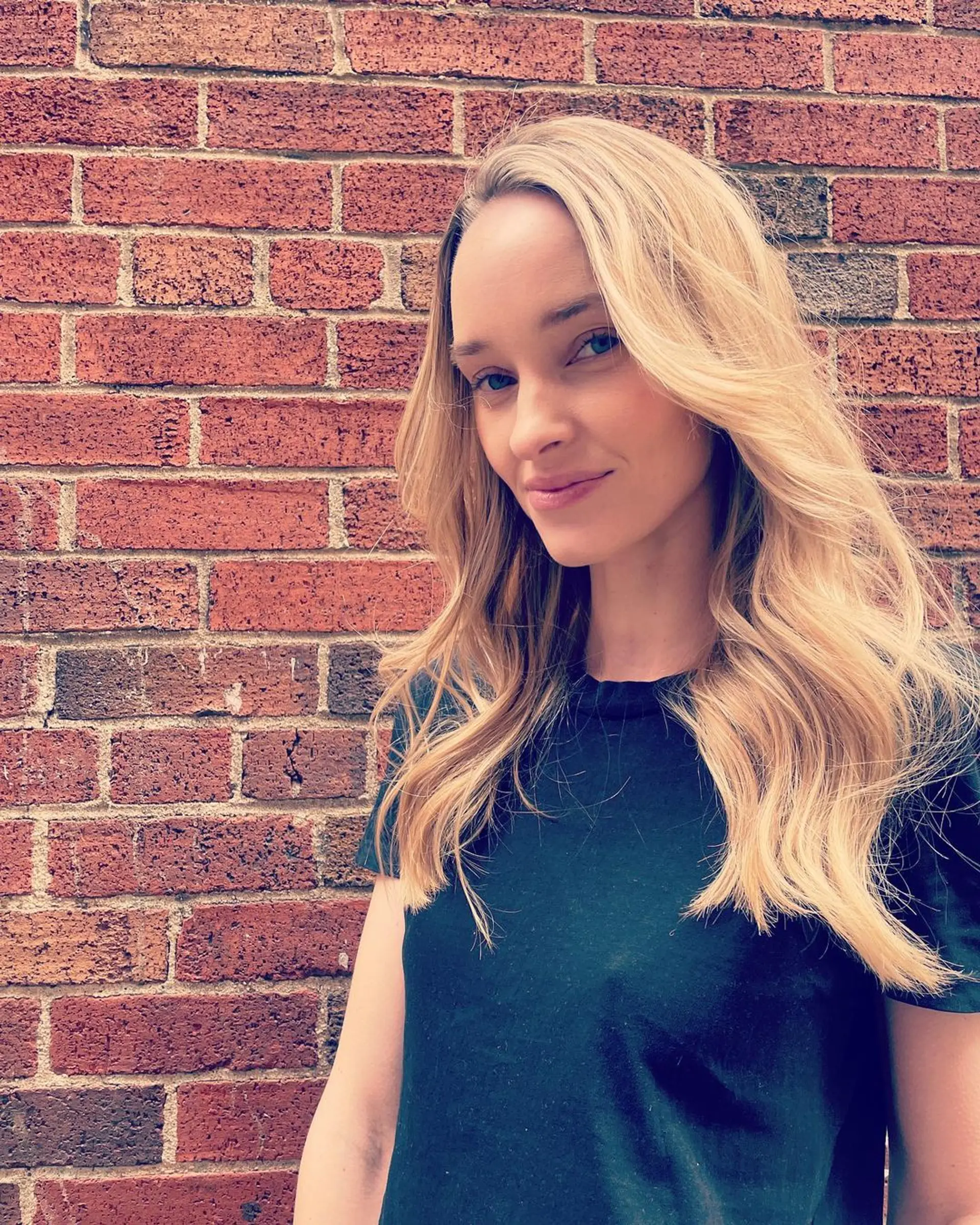 Long, wavy blonde hair with layers and a natural side part, creating an effortless and voluminous look. (Hair by Lynn) 2