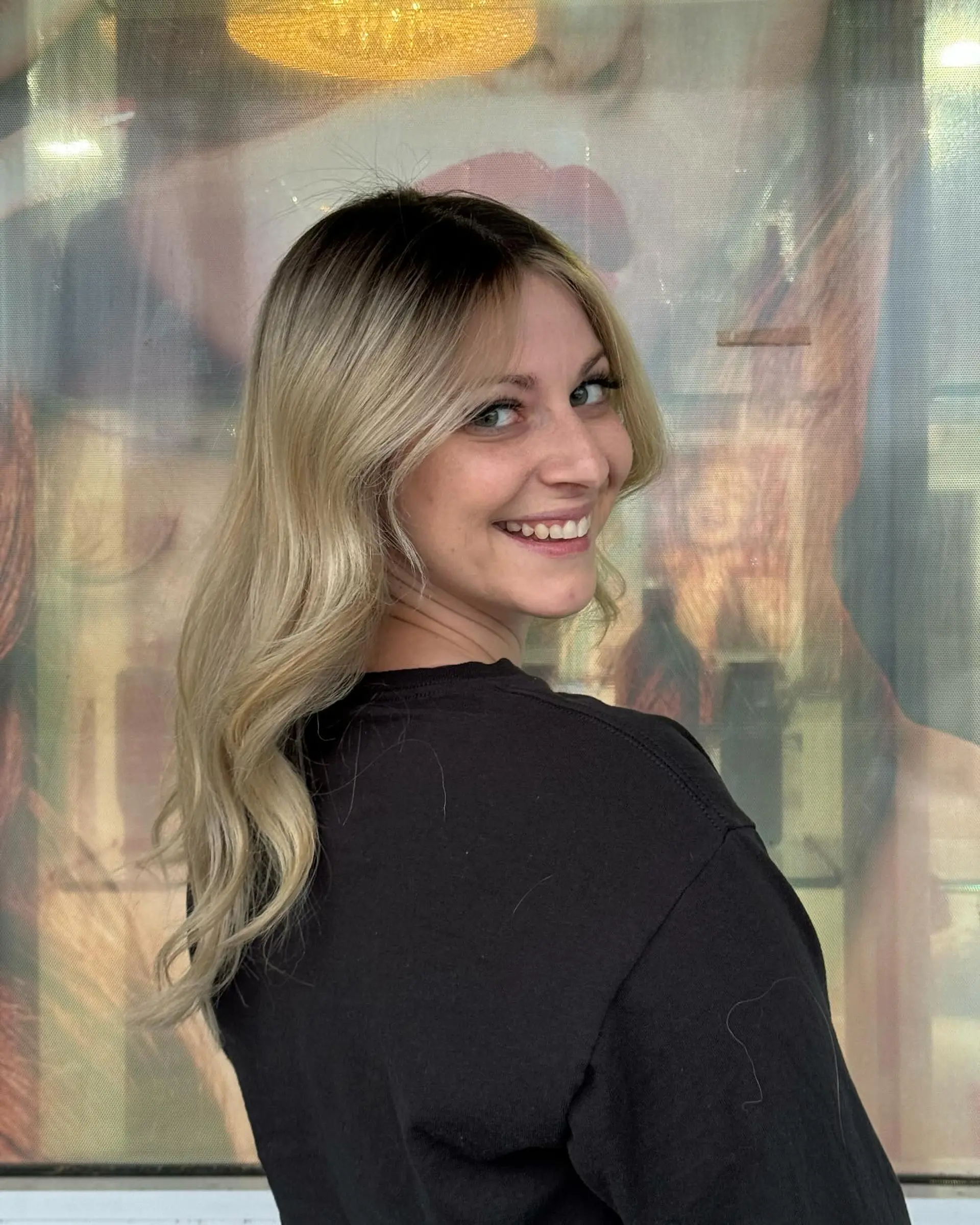 Long, wavy hair with a dark root ombre to blonde beach waves. 1