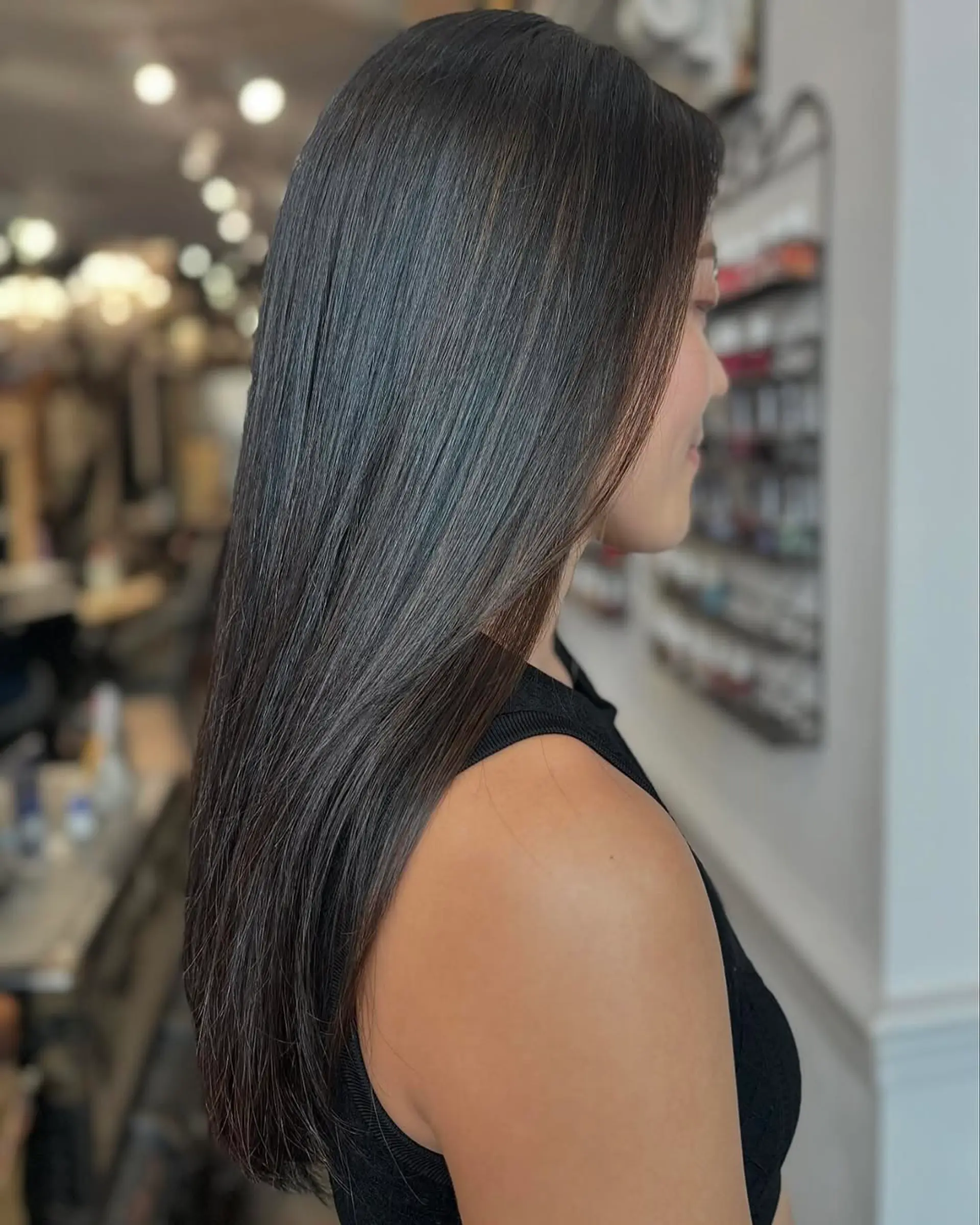Long, straight, sleek black hair with a glossy finish and minimal layers. 2