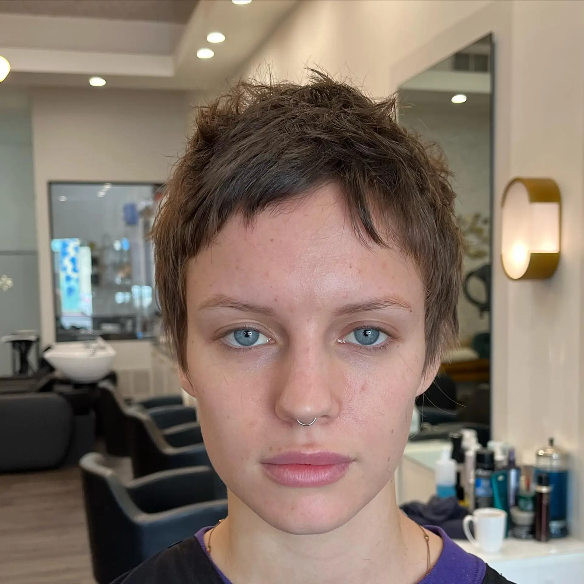 A textured, cropped pixie cut featuring piecey layers and short, choppy fringe. 1