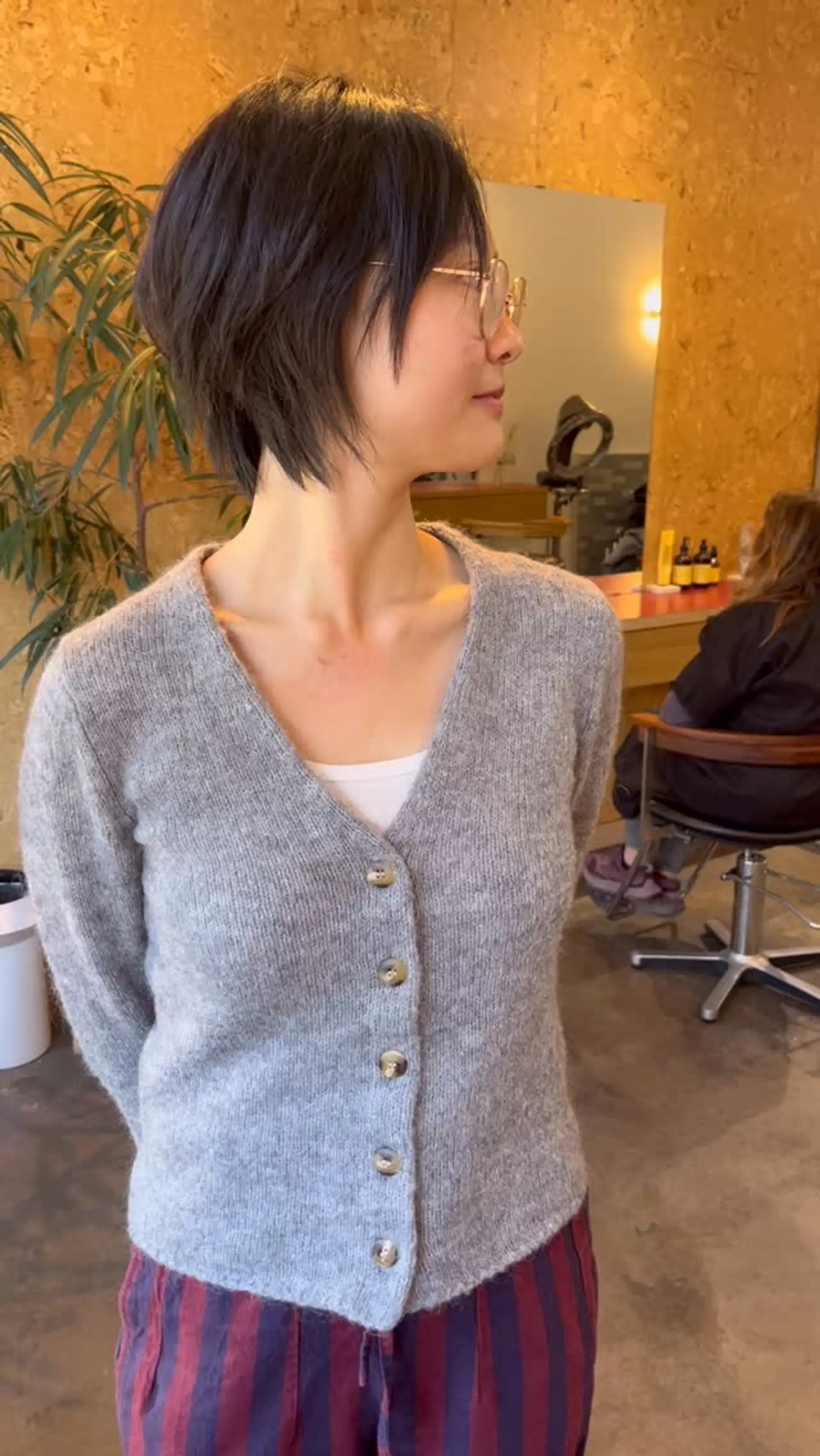 A short, piecey pixie crop with soft layers and wispy face-framing fringe. 1