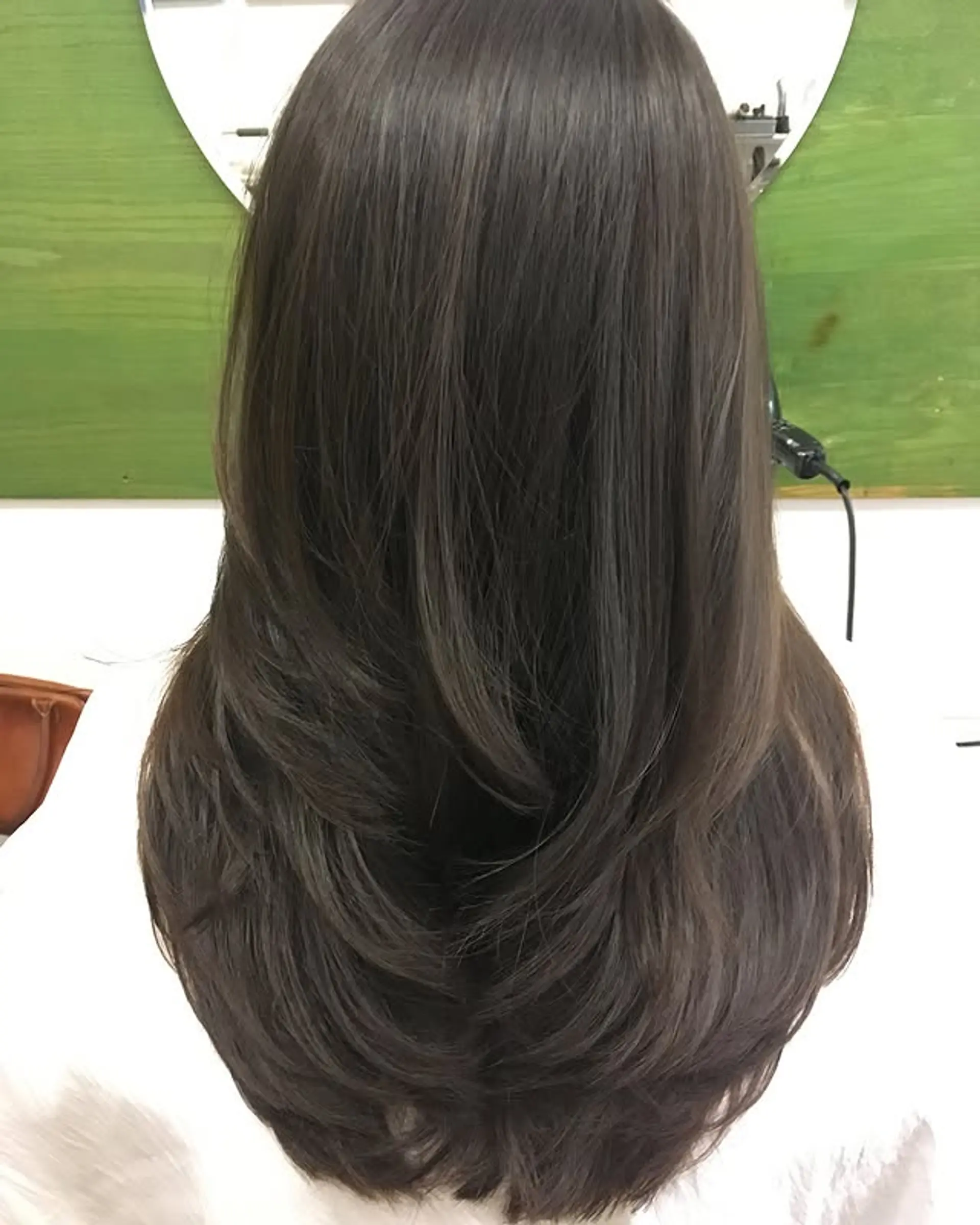 A medium-length cut with long layers for movement and body. 1