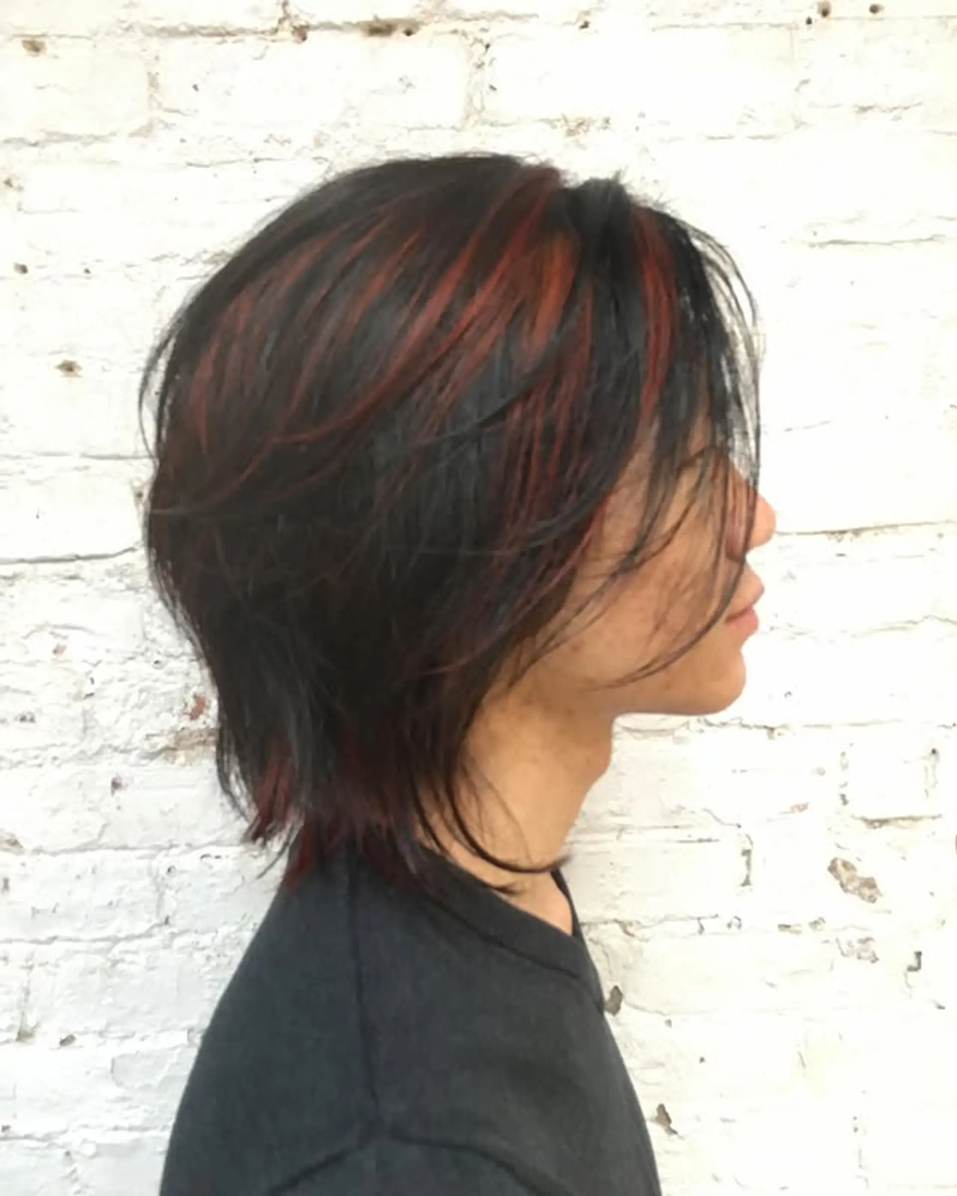 A choppy, layered shag with bold red highlights. 1