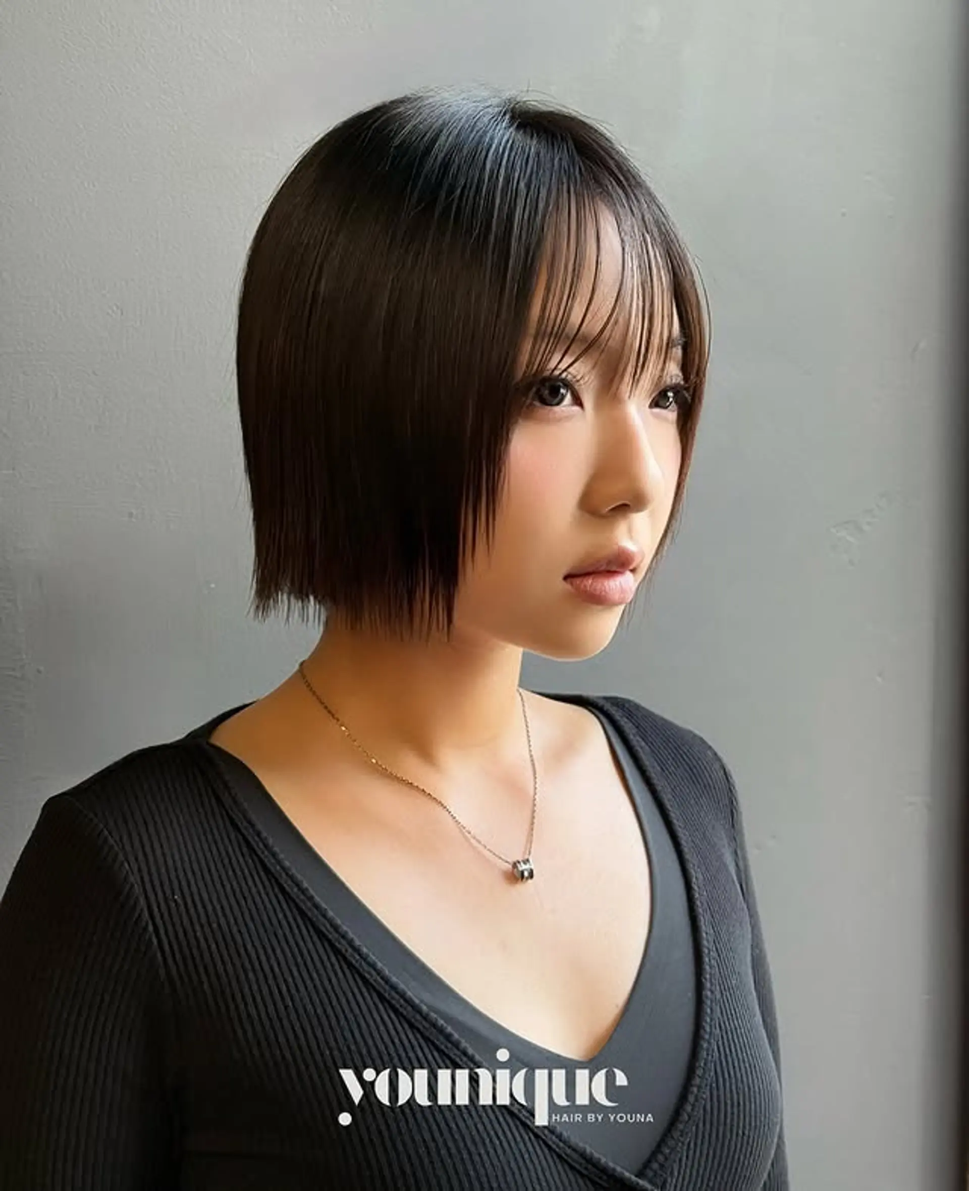 A chic, blunt bob with baby bangs that frames the face beautifully. 1