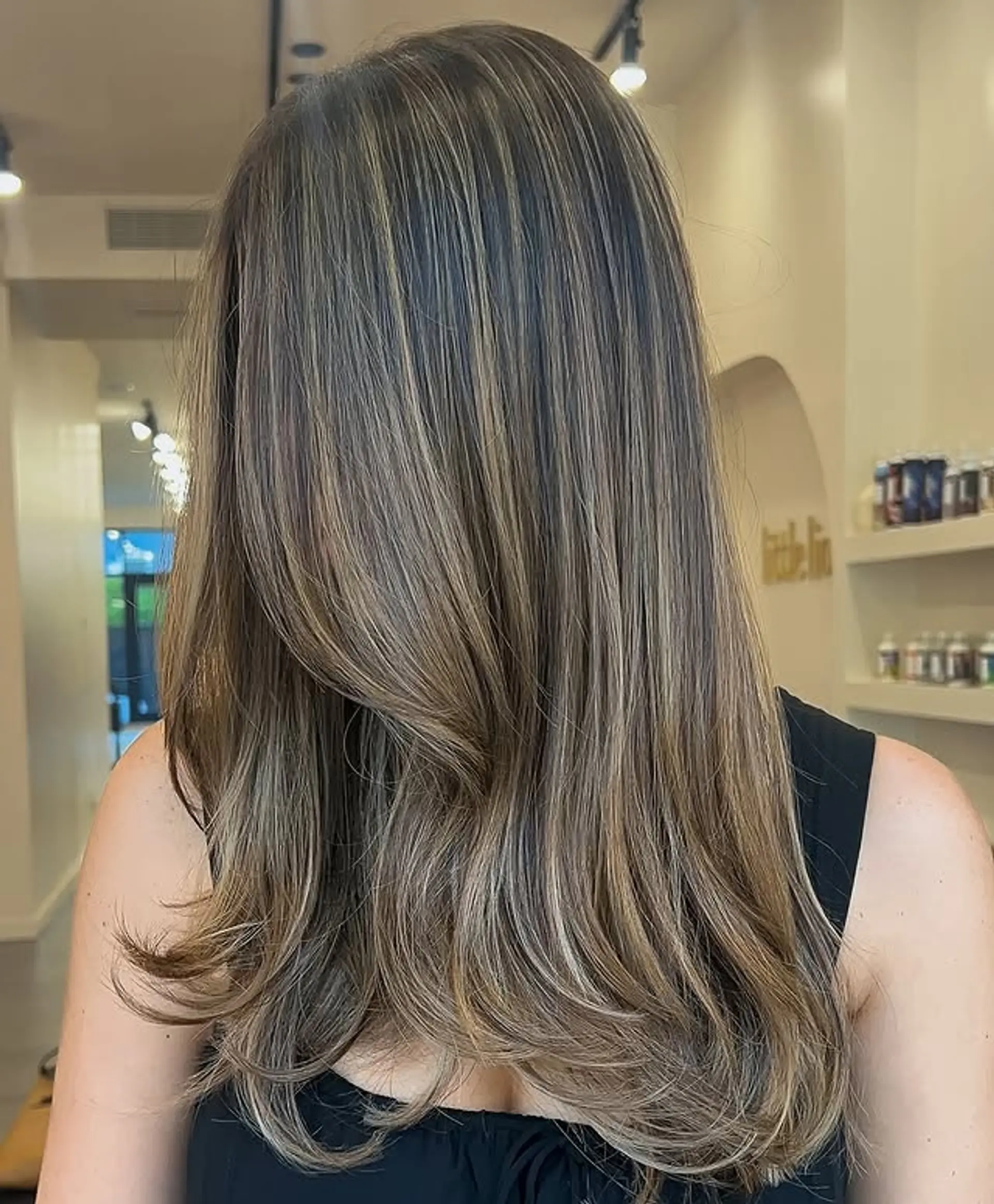 Long, layered hairstyle with balayage highlights. 1