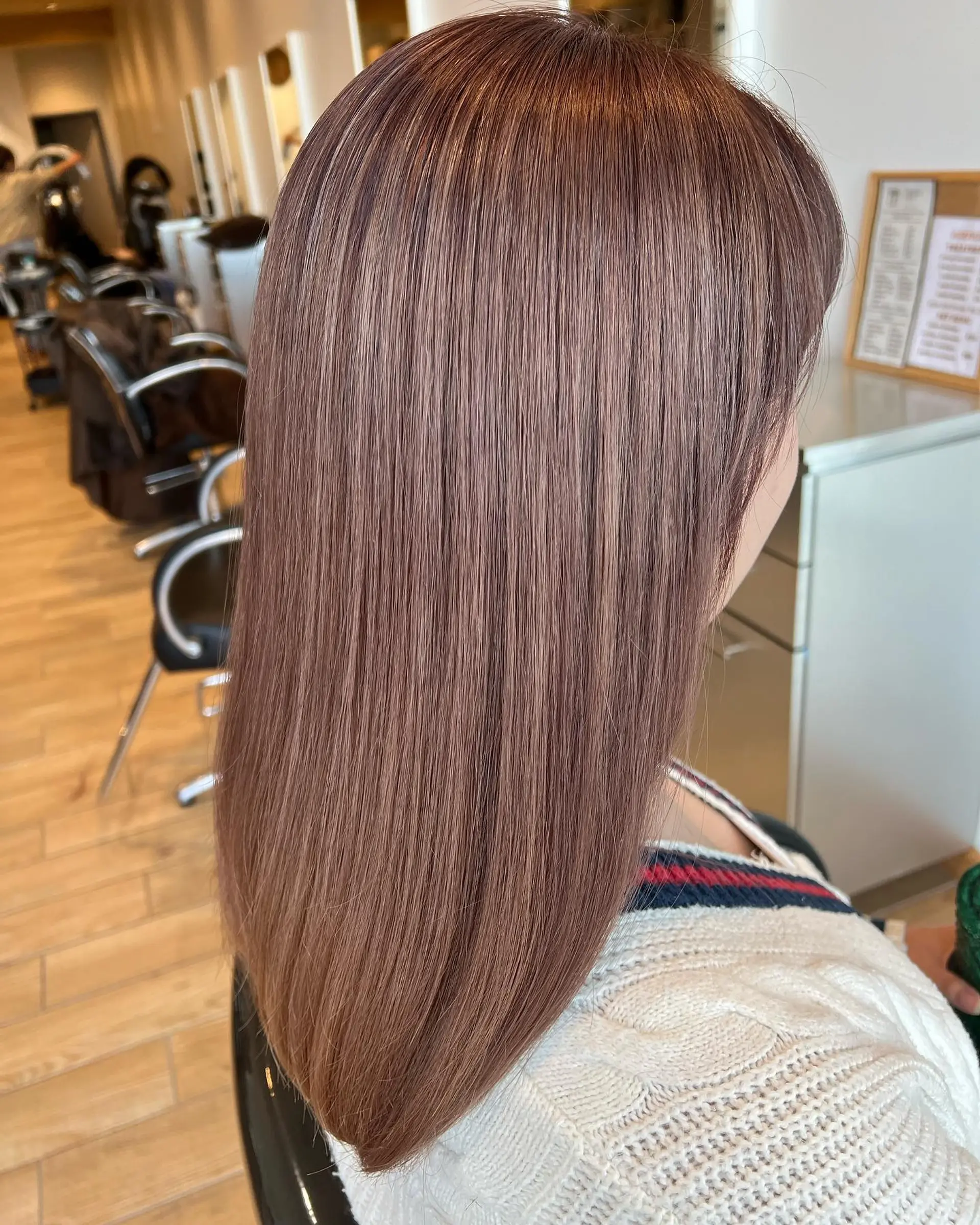 Straight, sleek long hair in a soft milk tea ash hue with a glossy, polished finish. 1