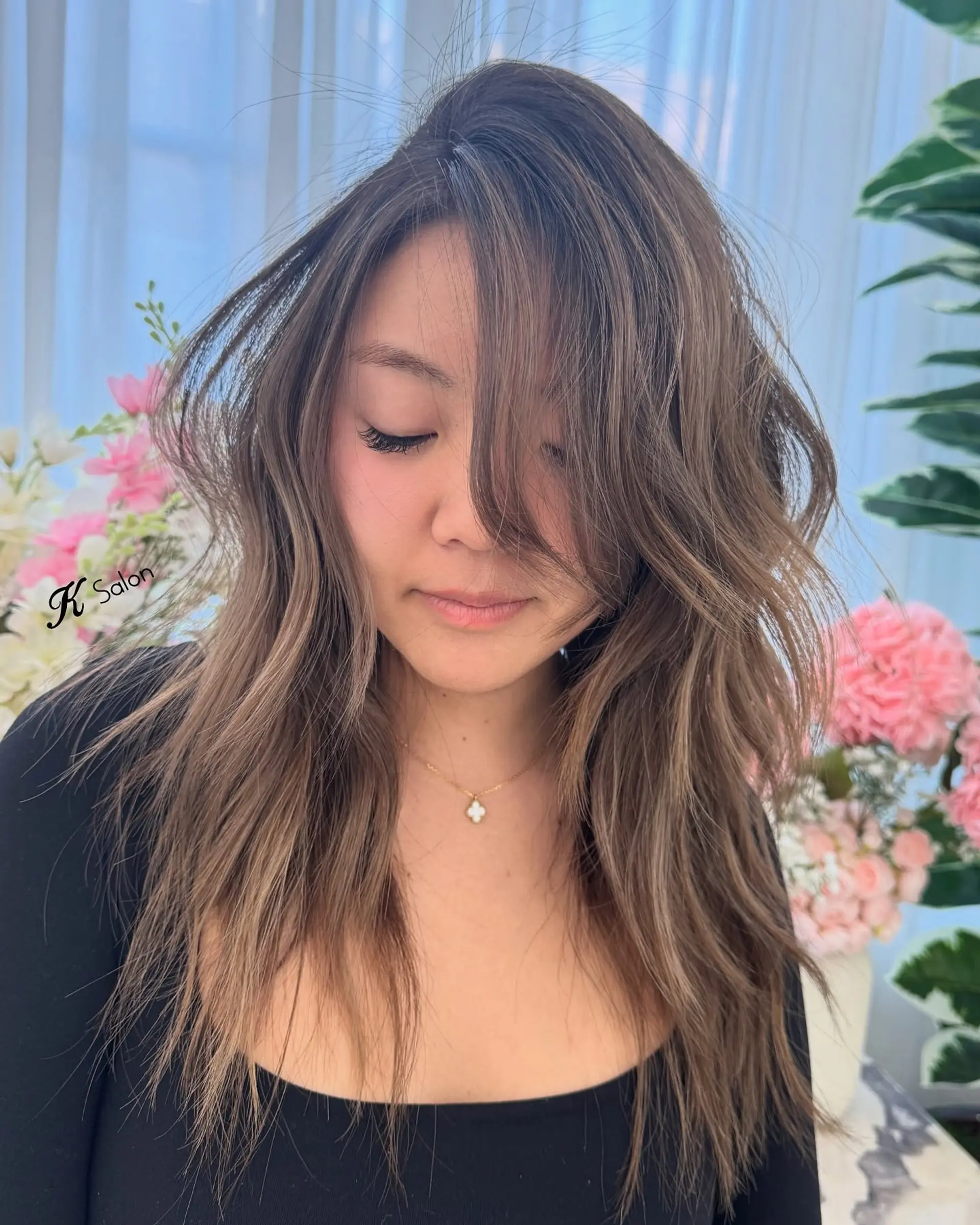 Long, layered haircut with subtle face framing layers. 1