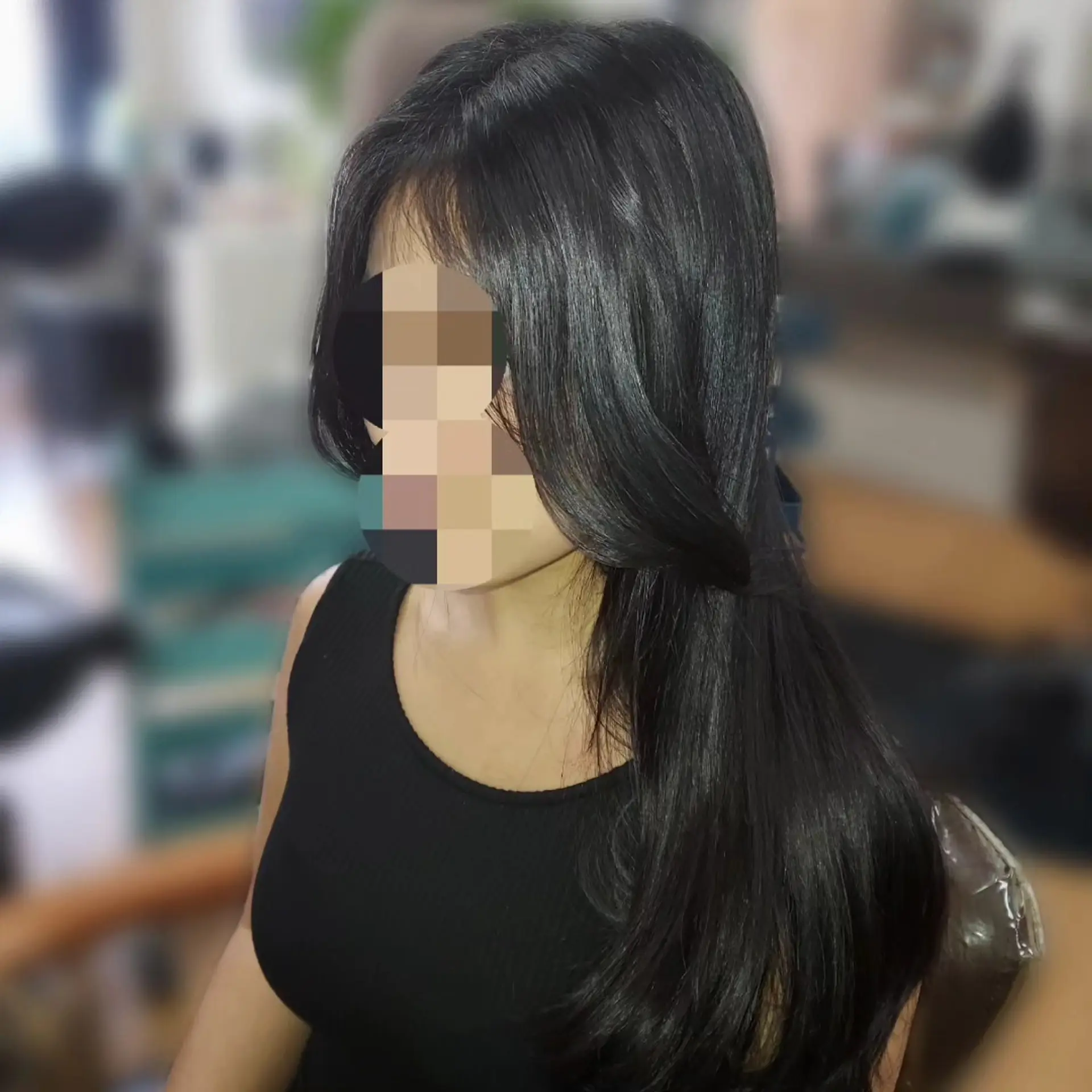Long, glossy black hair cut with soft face-framing layers and styled with a smooth, bouncy blowout. 1