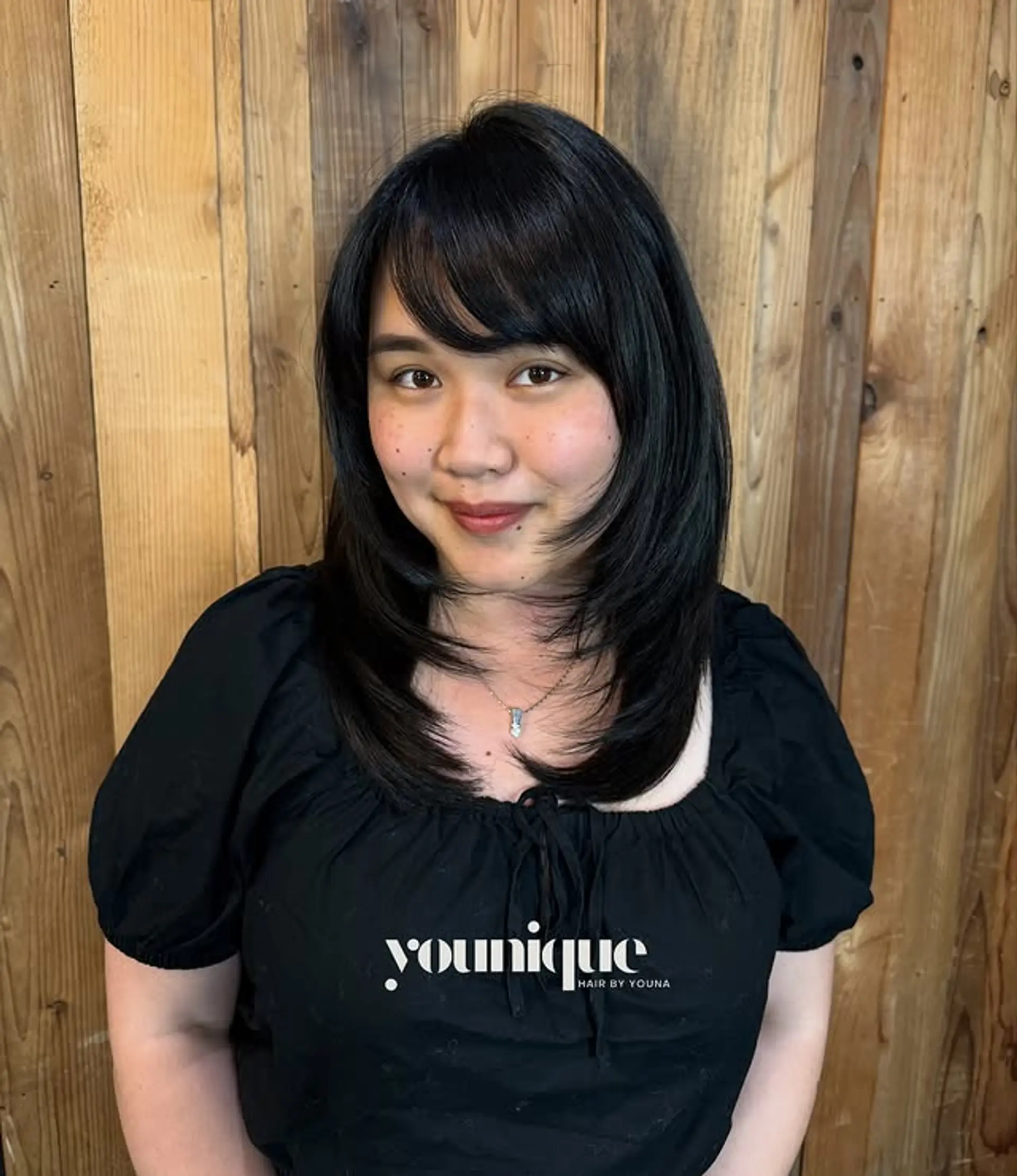 A layered bob with face-framing layers and curtain bangs. 1