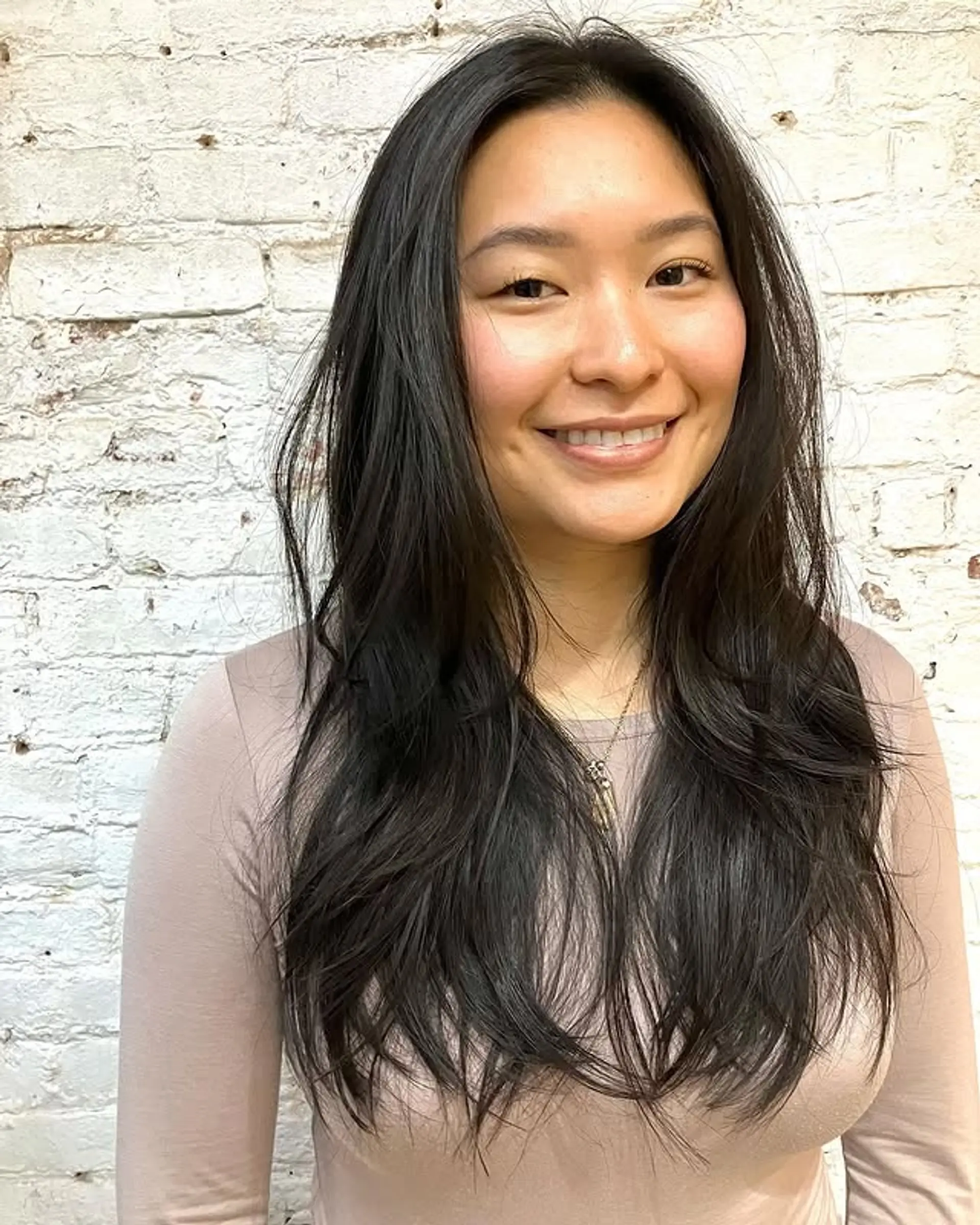 A long layered V cut with soft face-framing layers. 1