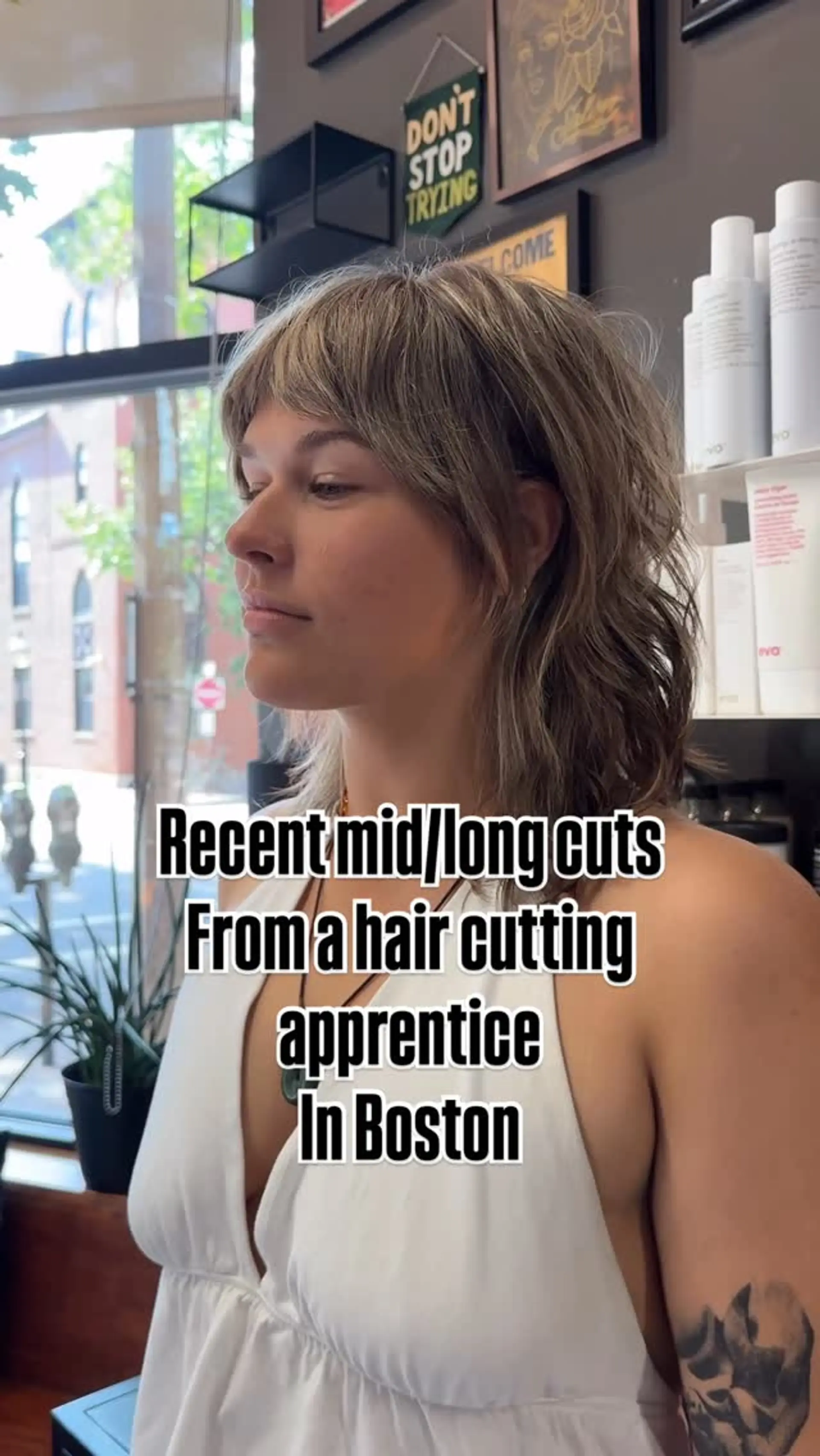 A textured mid-length modern shag haircut featuring choppy bangs and piecey, tousled layers. 1