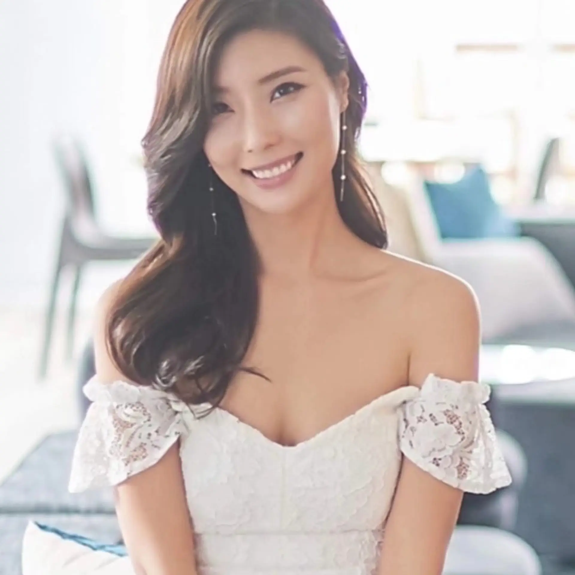 A romantic side-swept bridal hairstyle with smooth, voluminous waves cascading over one shoulder. 1
