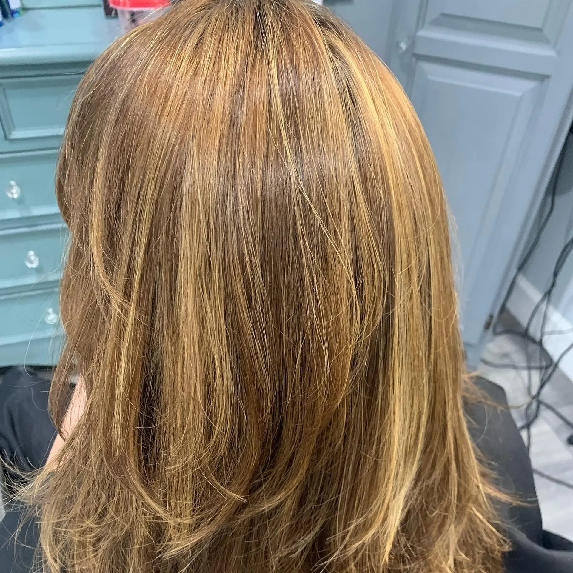 Medium-length layered cut featuring fine warm caramel and golden blonde highlights blended over a light brown base. 1