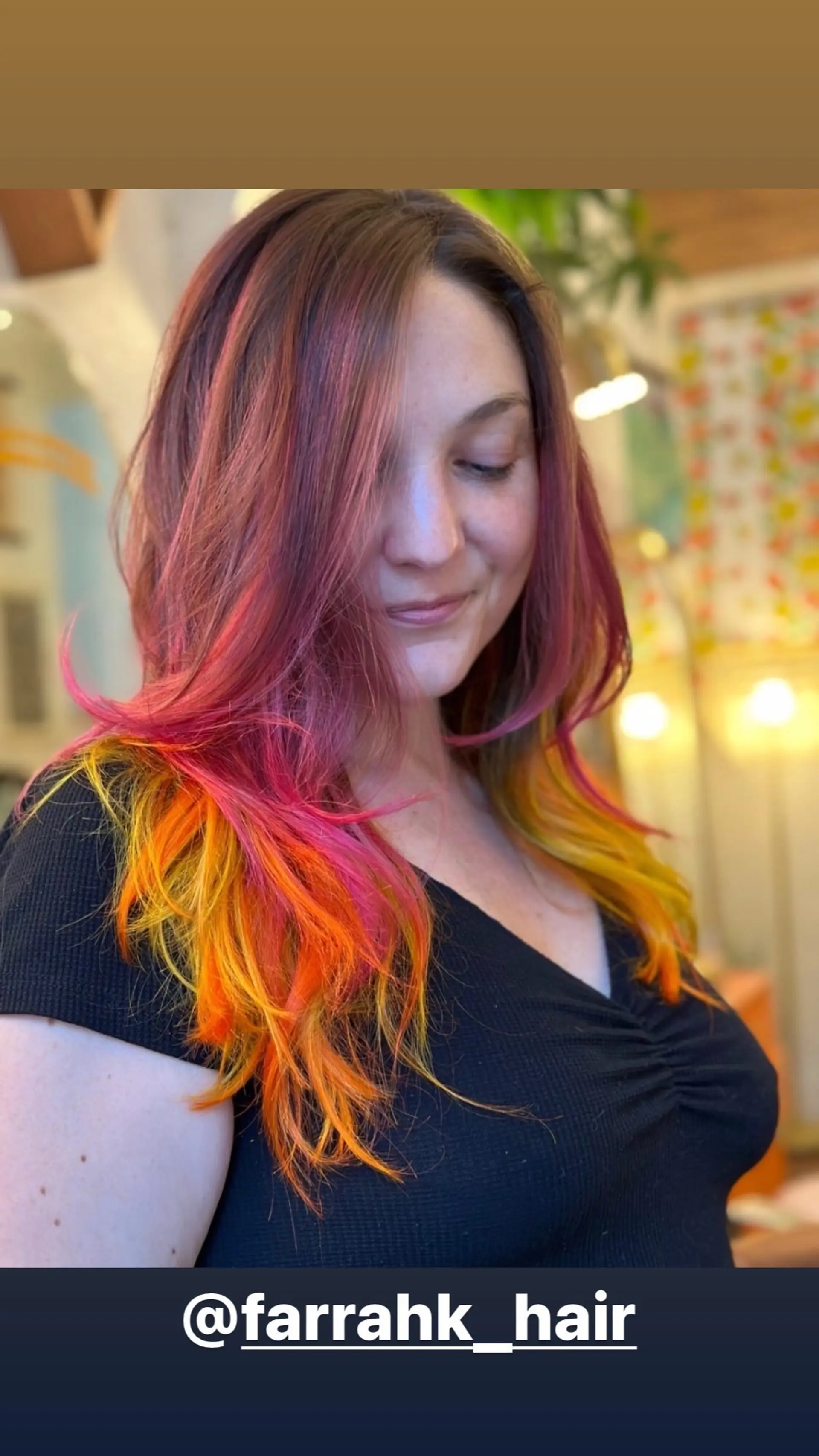 Medium-length layered hair with a sunset-inspired color melt, blending pink, orange, and yellow hues. 1