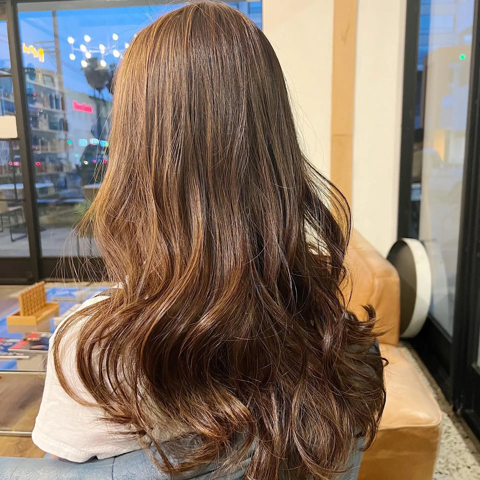 Long, wavy hairstyle with copper balayage. 1
