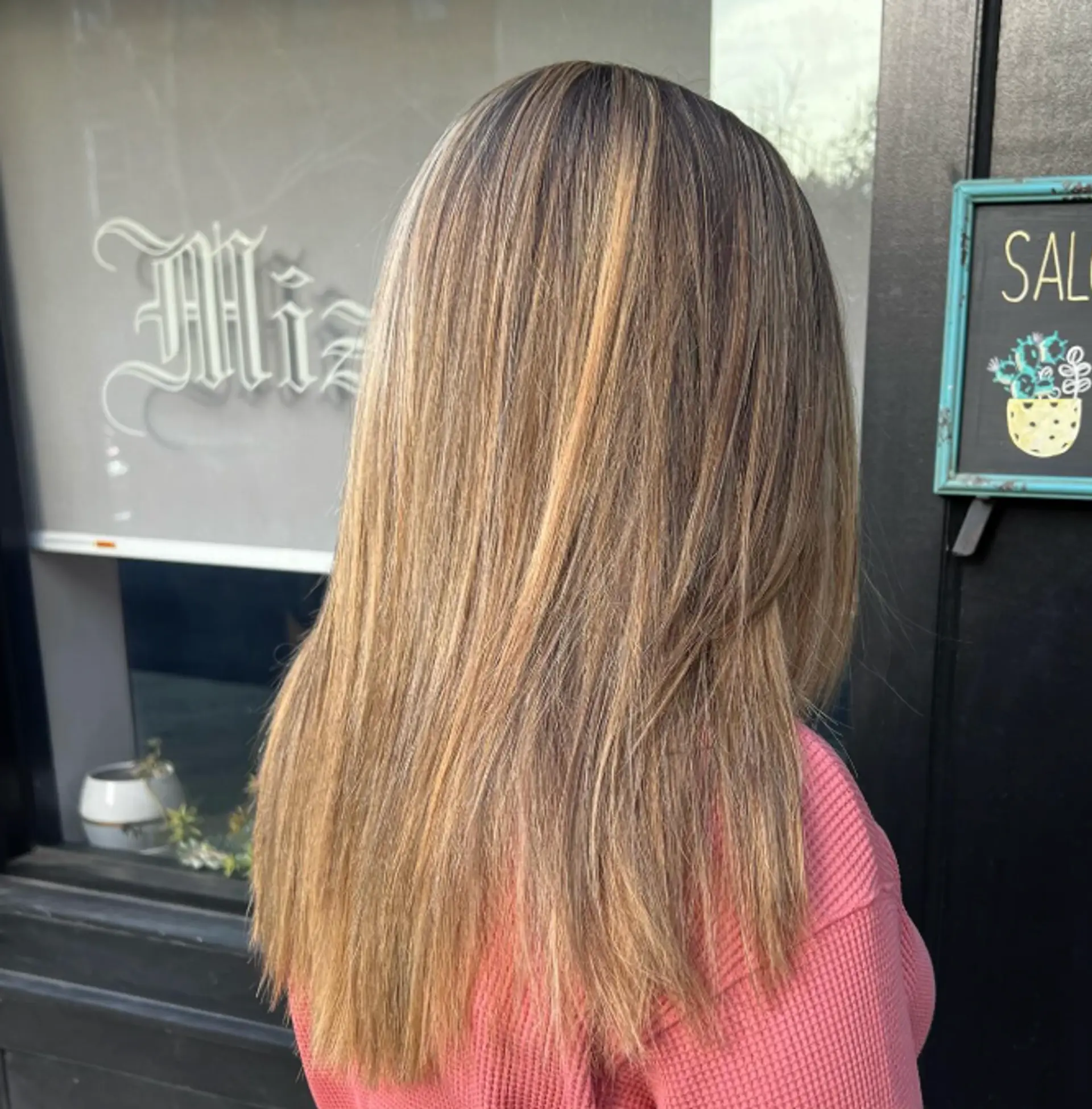 A long, layered hairstyle with a bronde balayage. 1