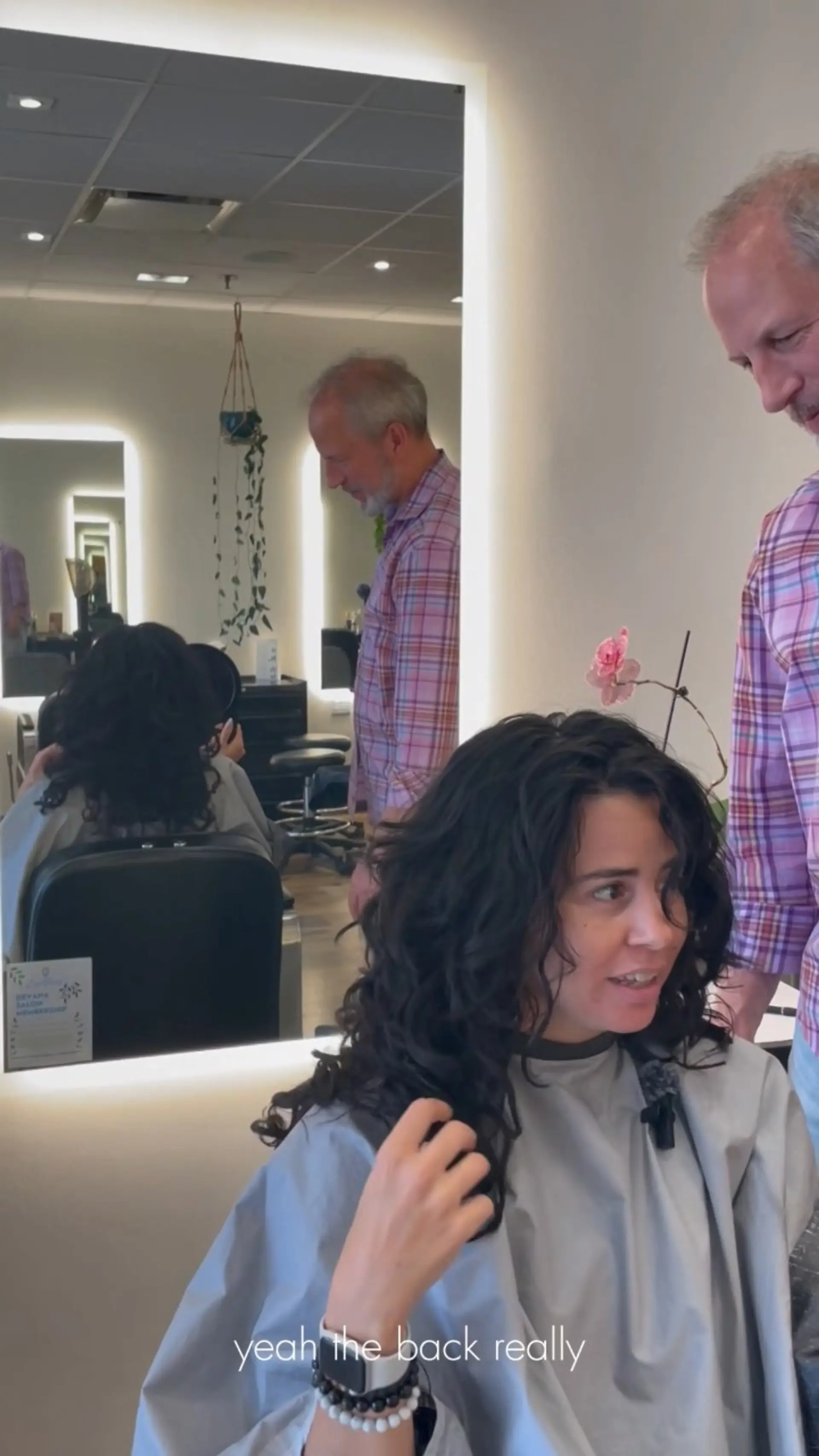 Medium-length curly shag featuring defined, textured curls with layered volume throughout. 1