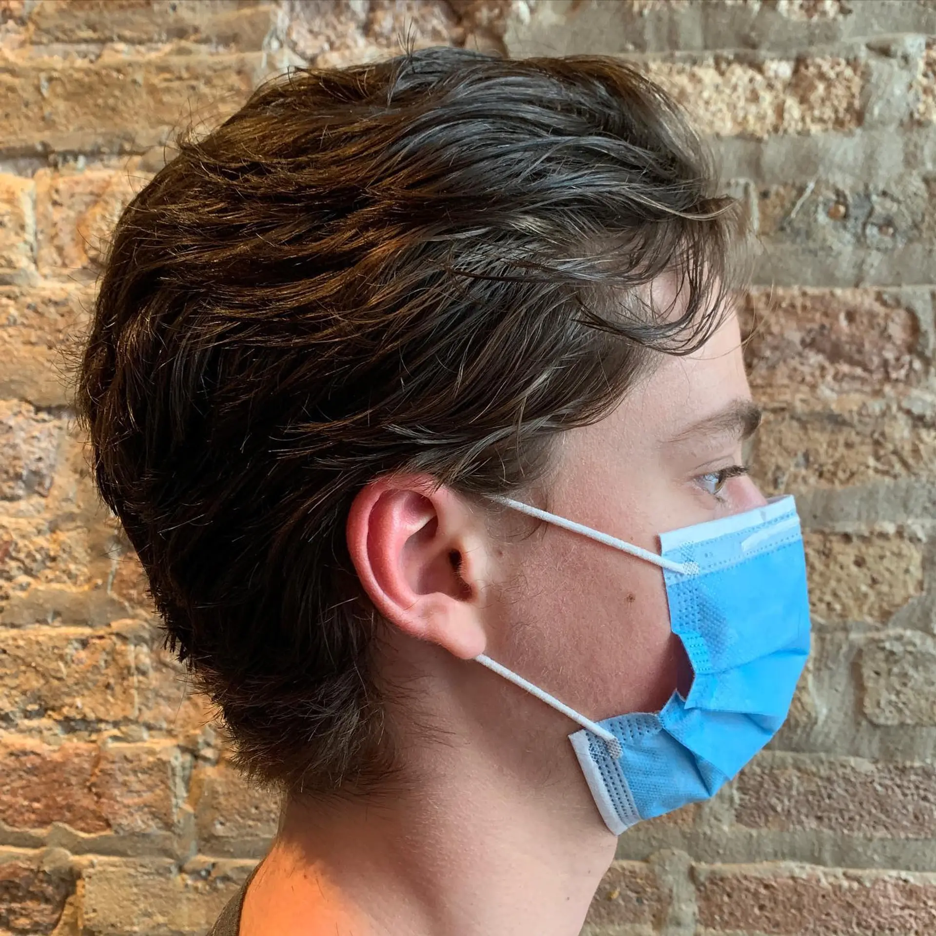 A short, textured haircut with a classic and casual style. 1