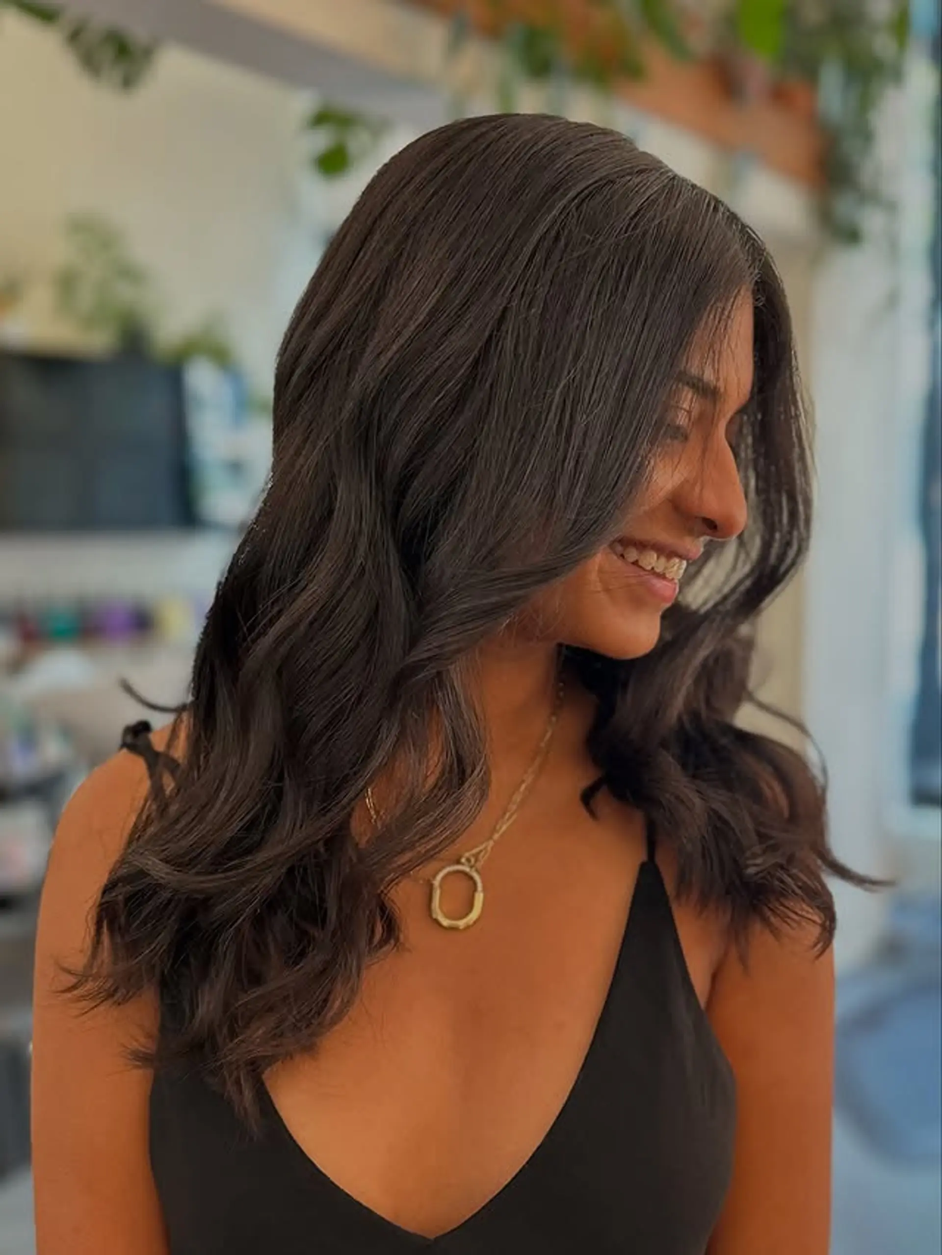 A medium-length hairstyle with soft, glamorous waves. 1