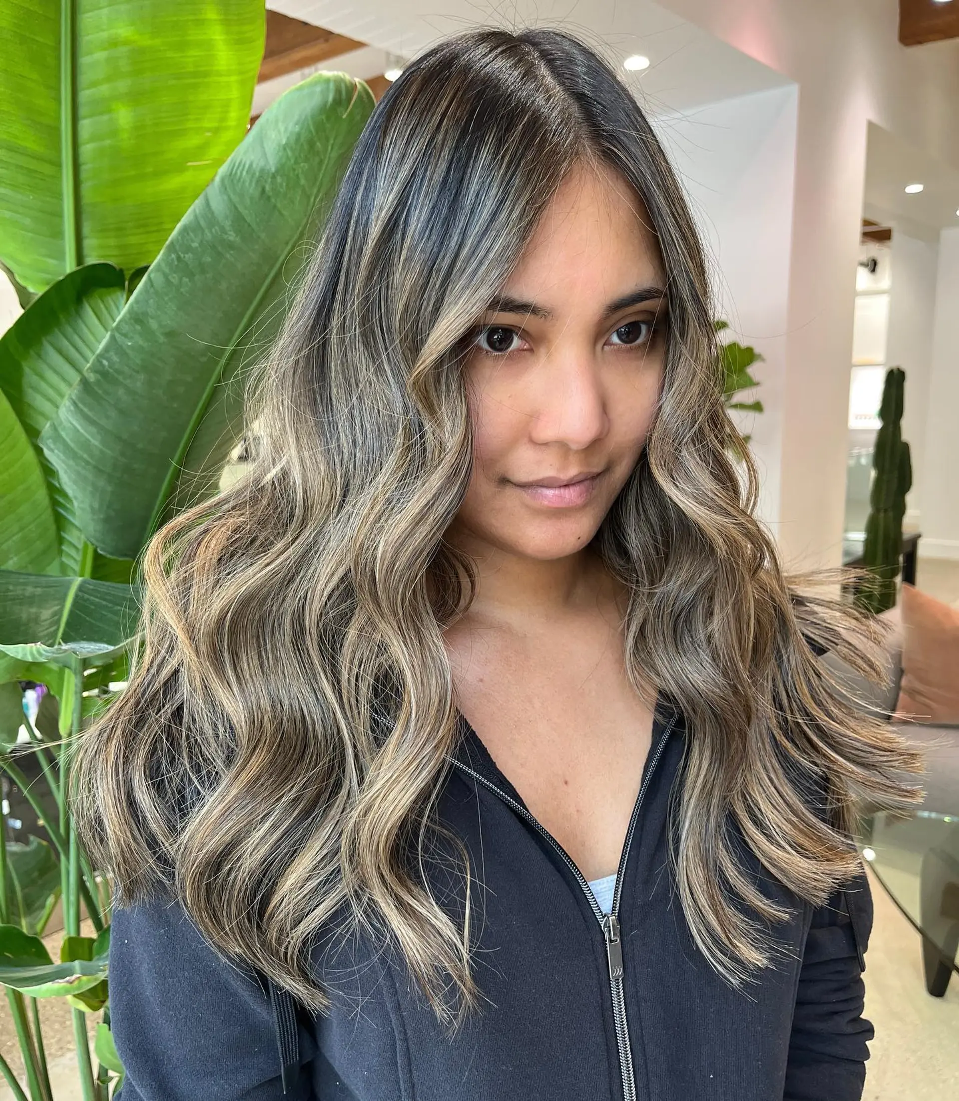 Long, wavy hair with a brunette to blonde balayage. 1