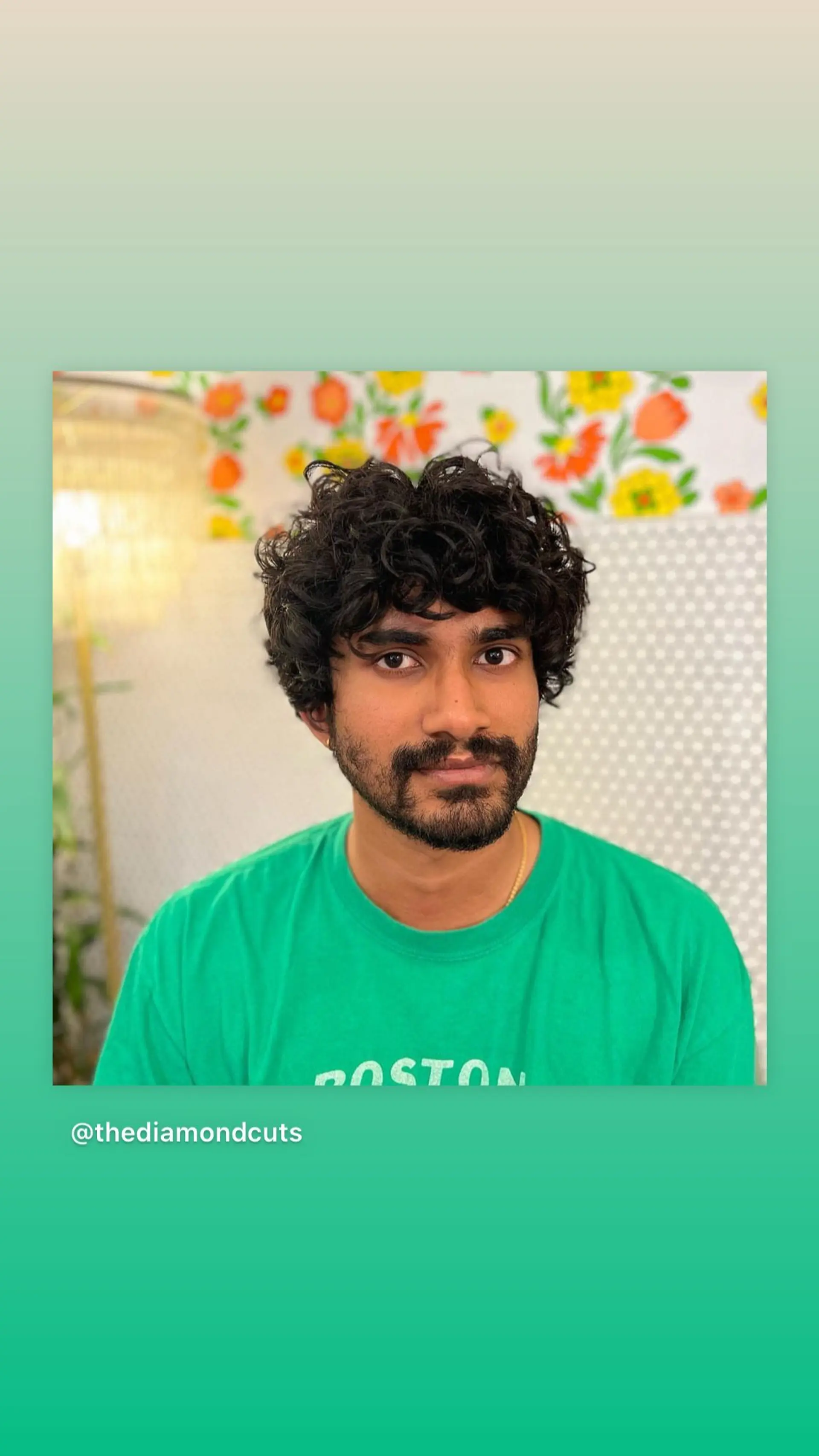 A short, textured curly hairstyle with defined curls. 1