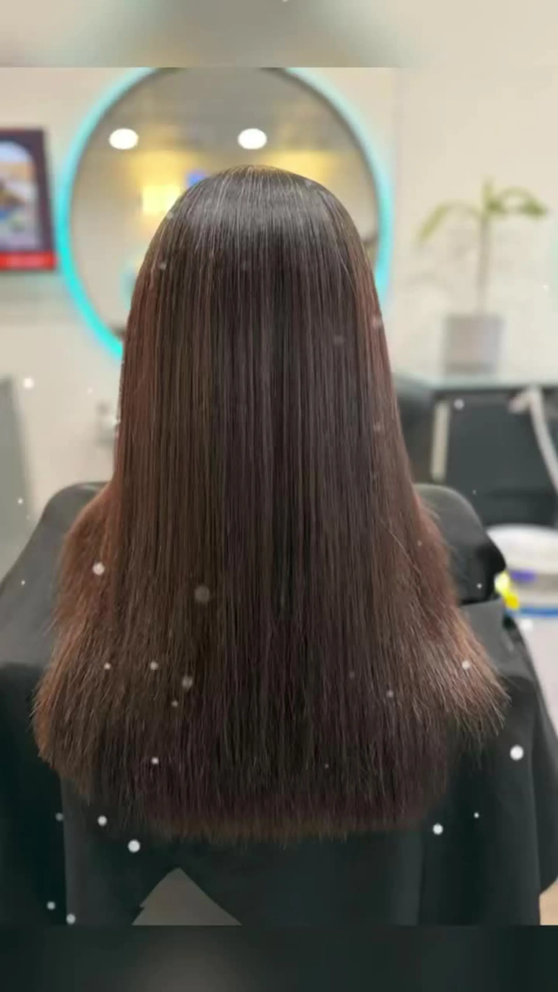 Sleek, glossy, pin-straight dark brown hair with an even, smooth texture falling straight down the back. 1