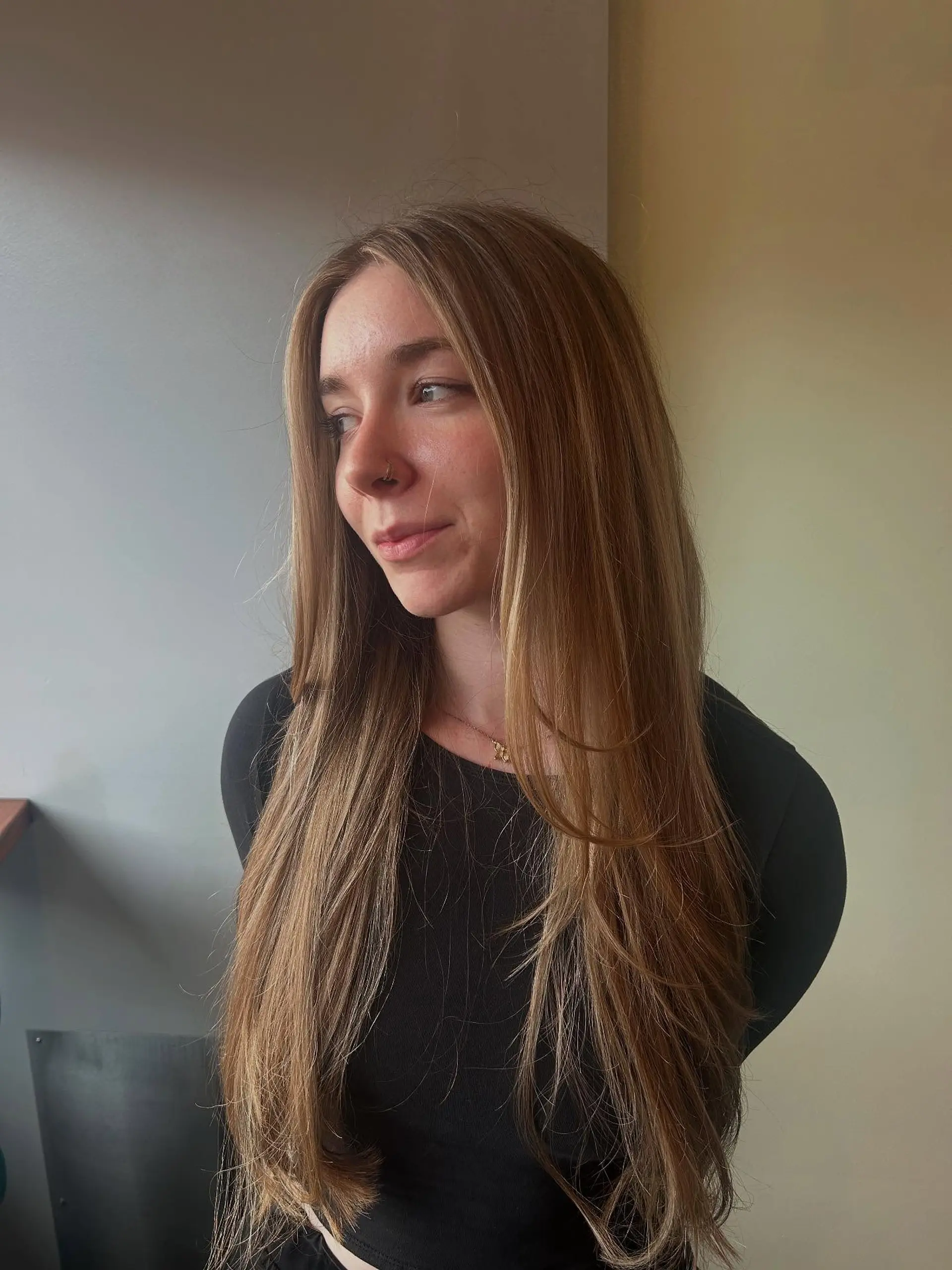 Extra-long straight hair styled with subtle face-framing layers and soft dimension. 1