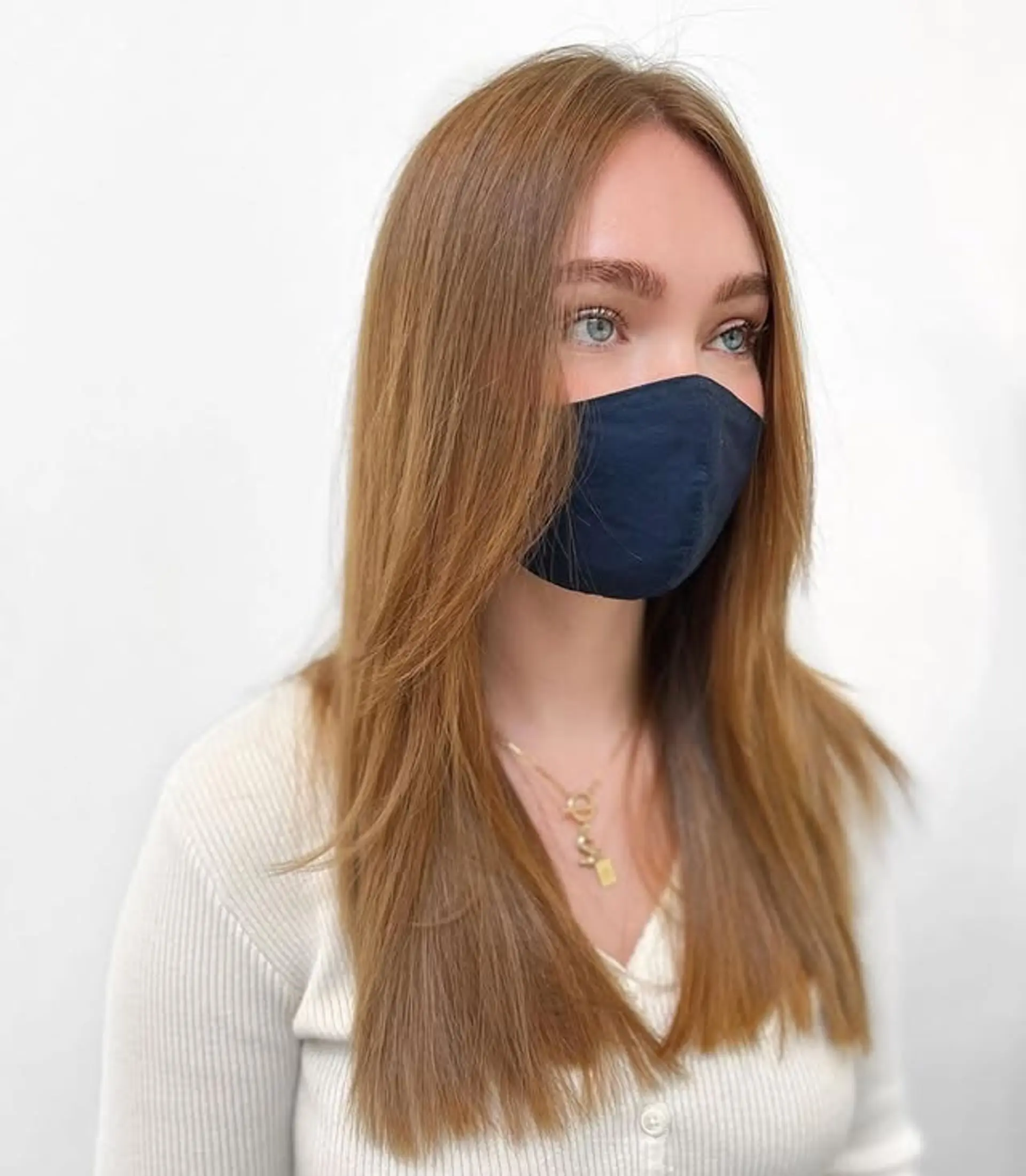 Long, straight hairstyle with layers and face-framing. 1