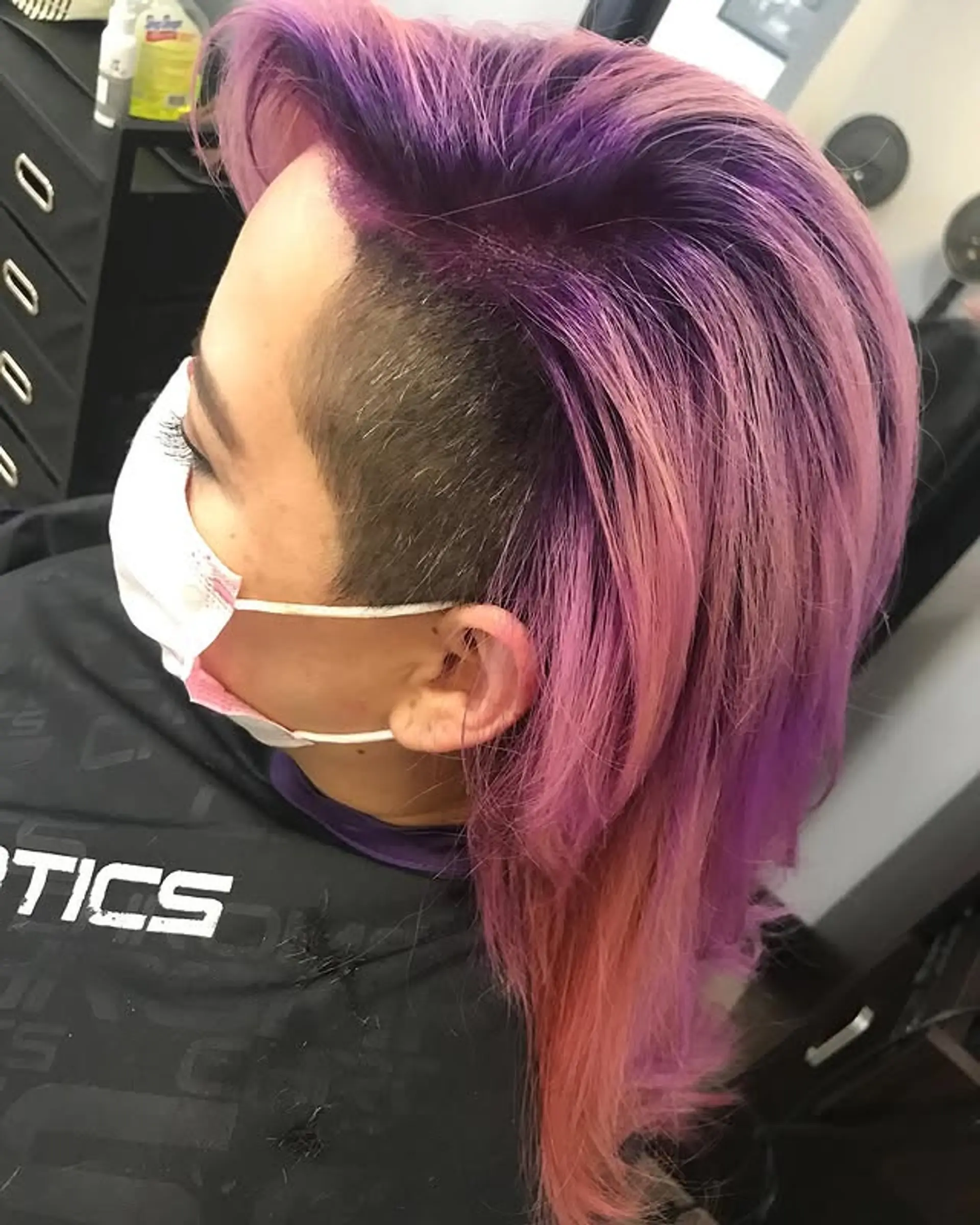 A trendy mullet with an edgy undercut and a bold fantasy color combination. 1